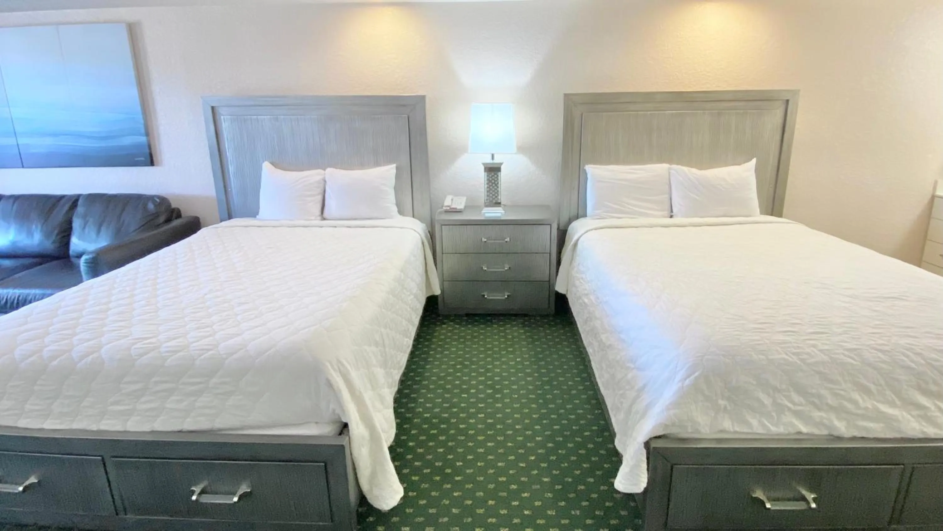 Bed in Royal Inn Hotel