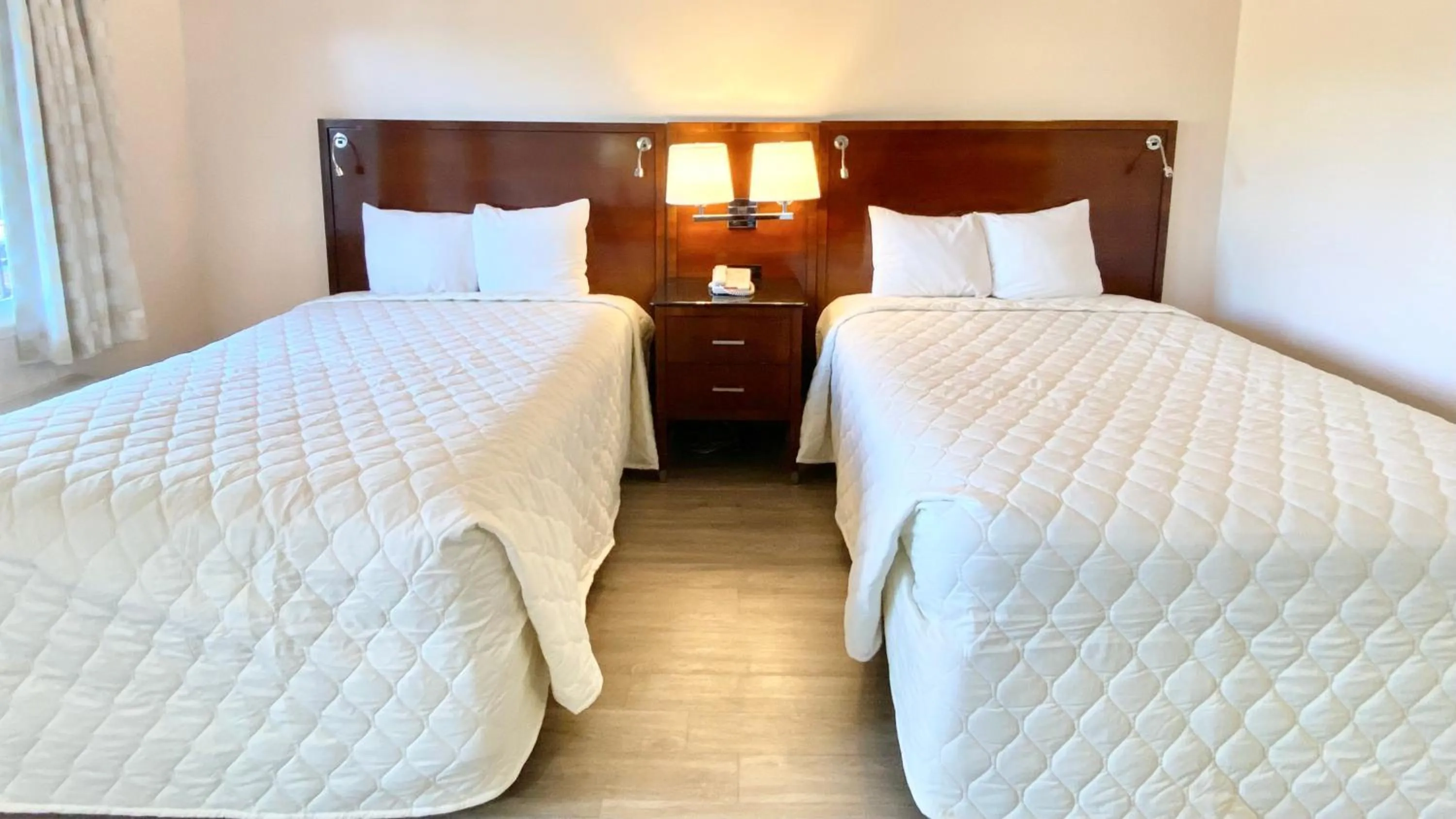 Bed in Royal Inn Hotel