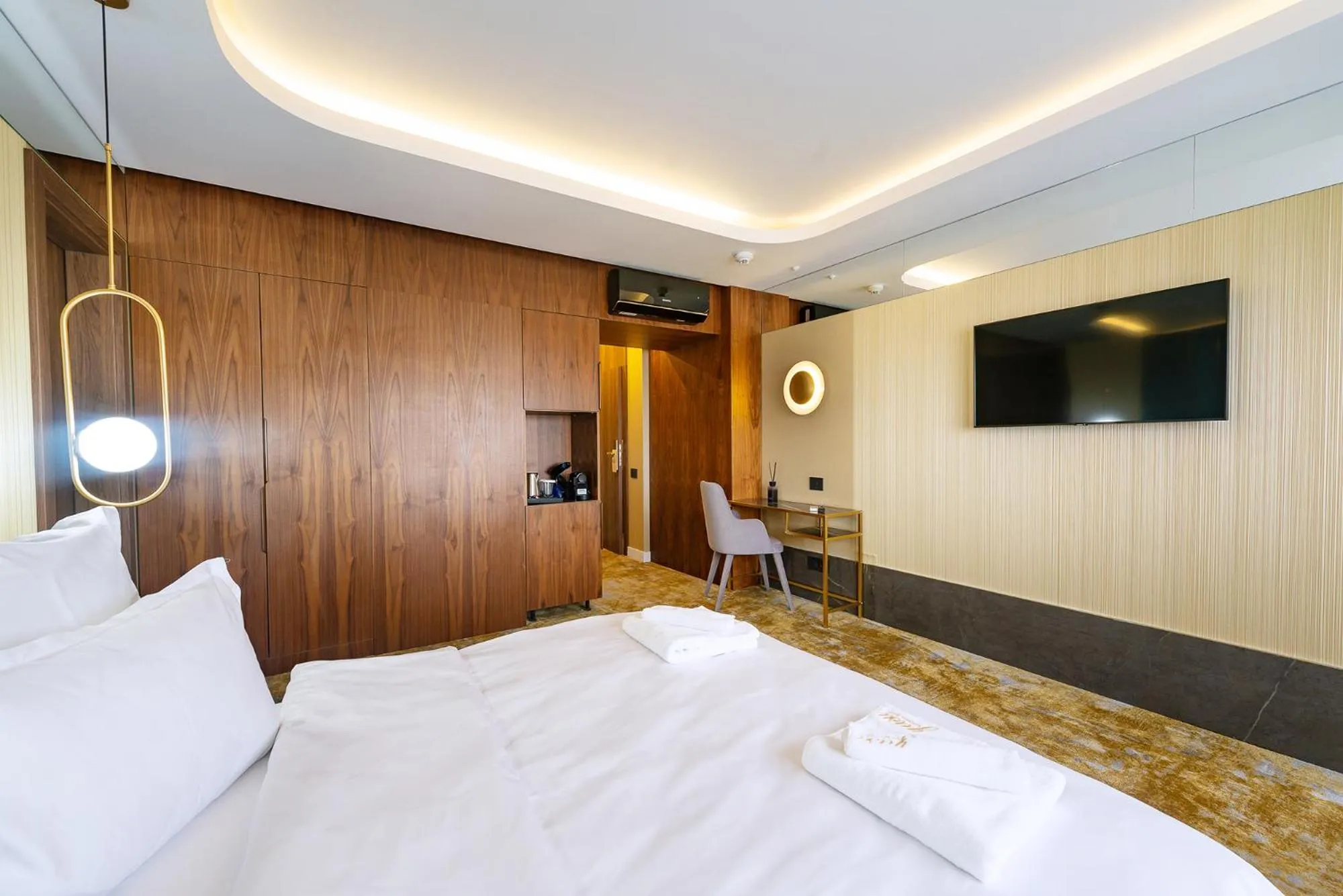 Bed in Yasu Luxury Rooms