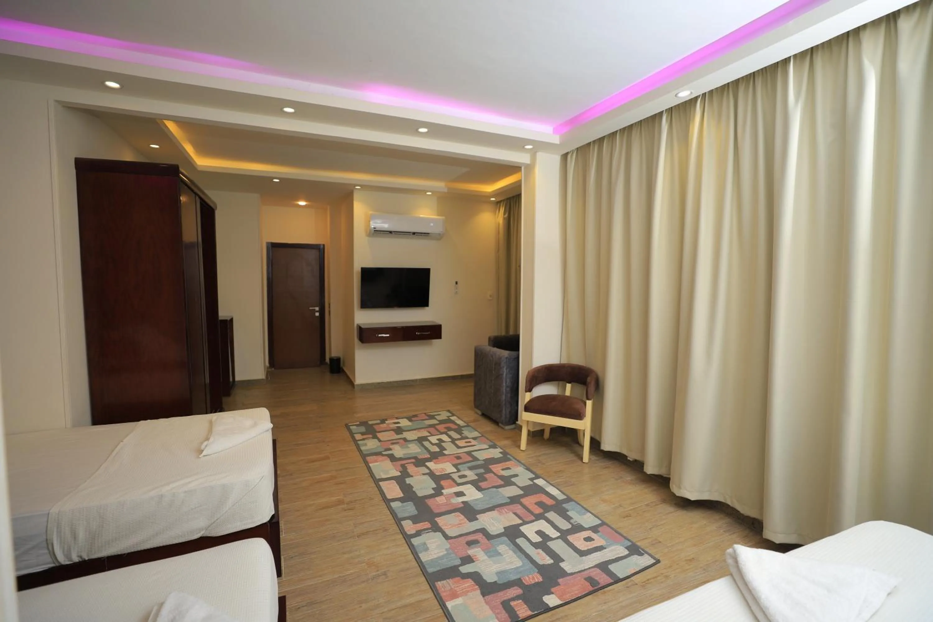 Communal lounge/ TV room, Bed in Grand Museum Pyramids View Hotel