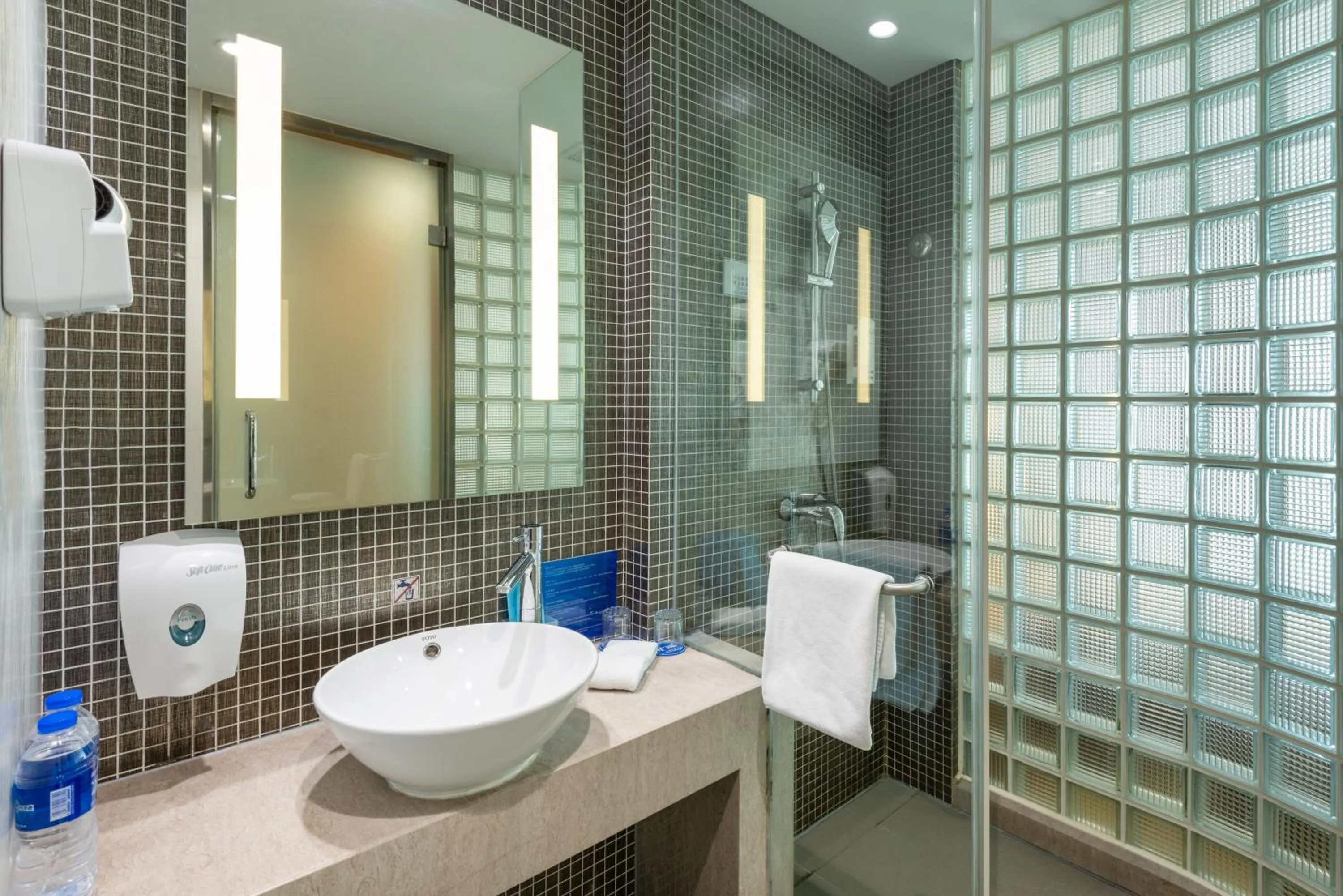 Bathroom in Holiday Inn Express Shanghai Gongkang by IHG