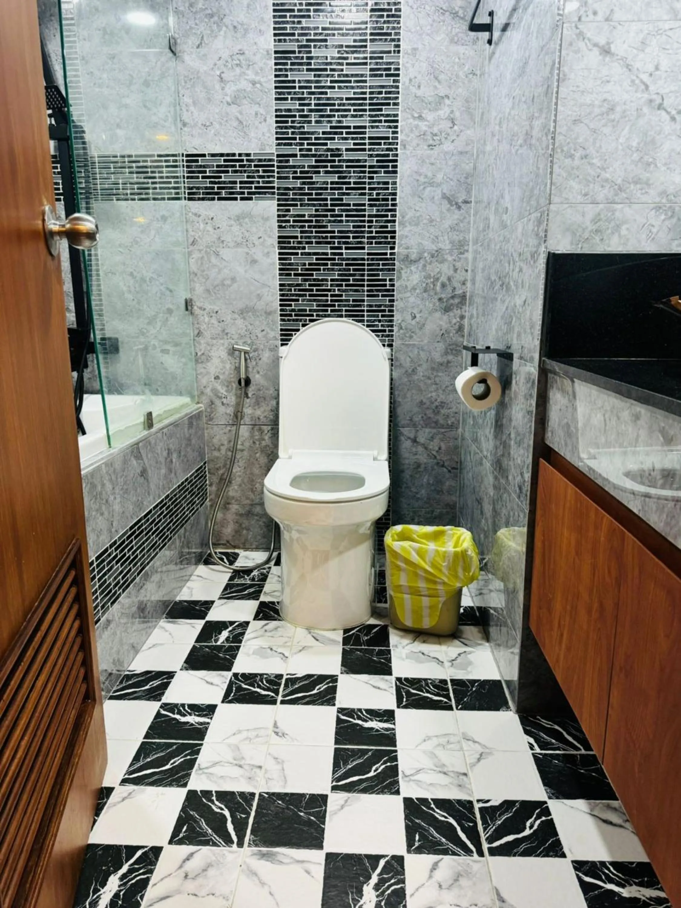 Toilet in Omni Tower Cozy Apartments by Direct Rooms