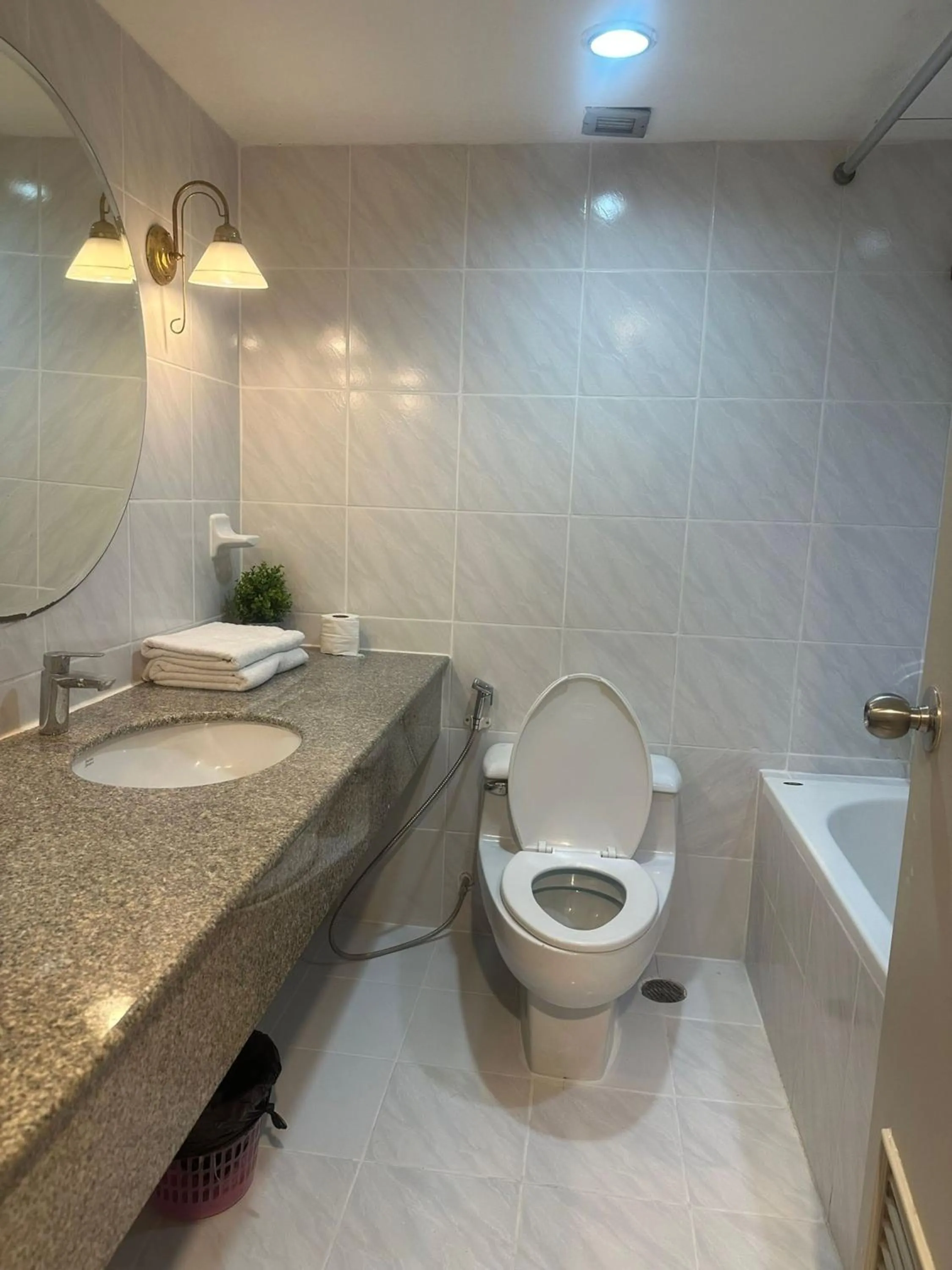 Toilet in Omni Tower Cozy Apartments by Direct Rooms