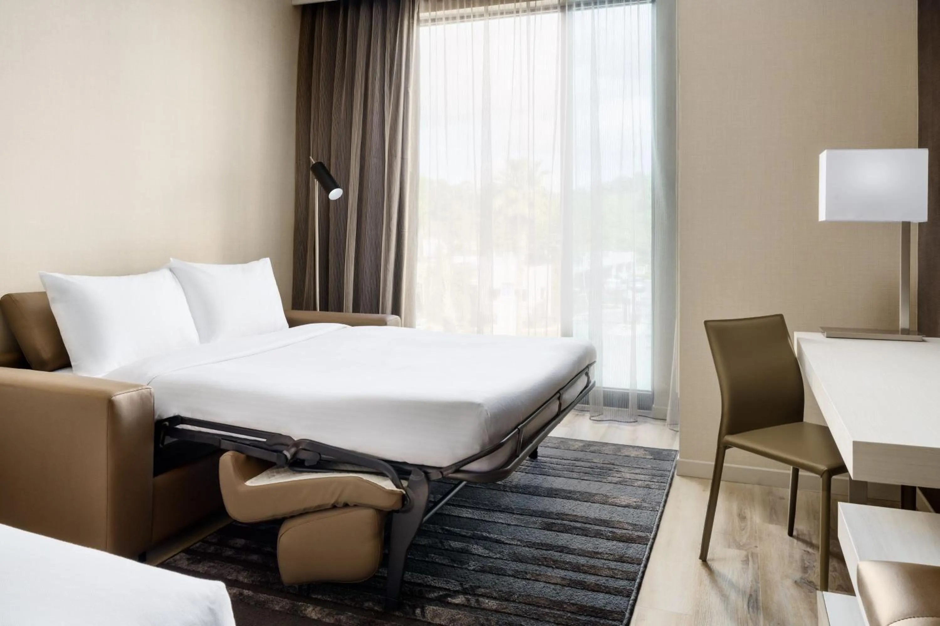 Photo of the whole room, Bed in AC Hotel by Marriott Jacksonville St Johns Town Center