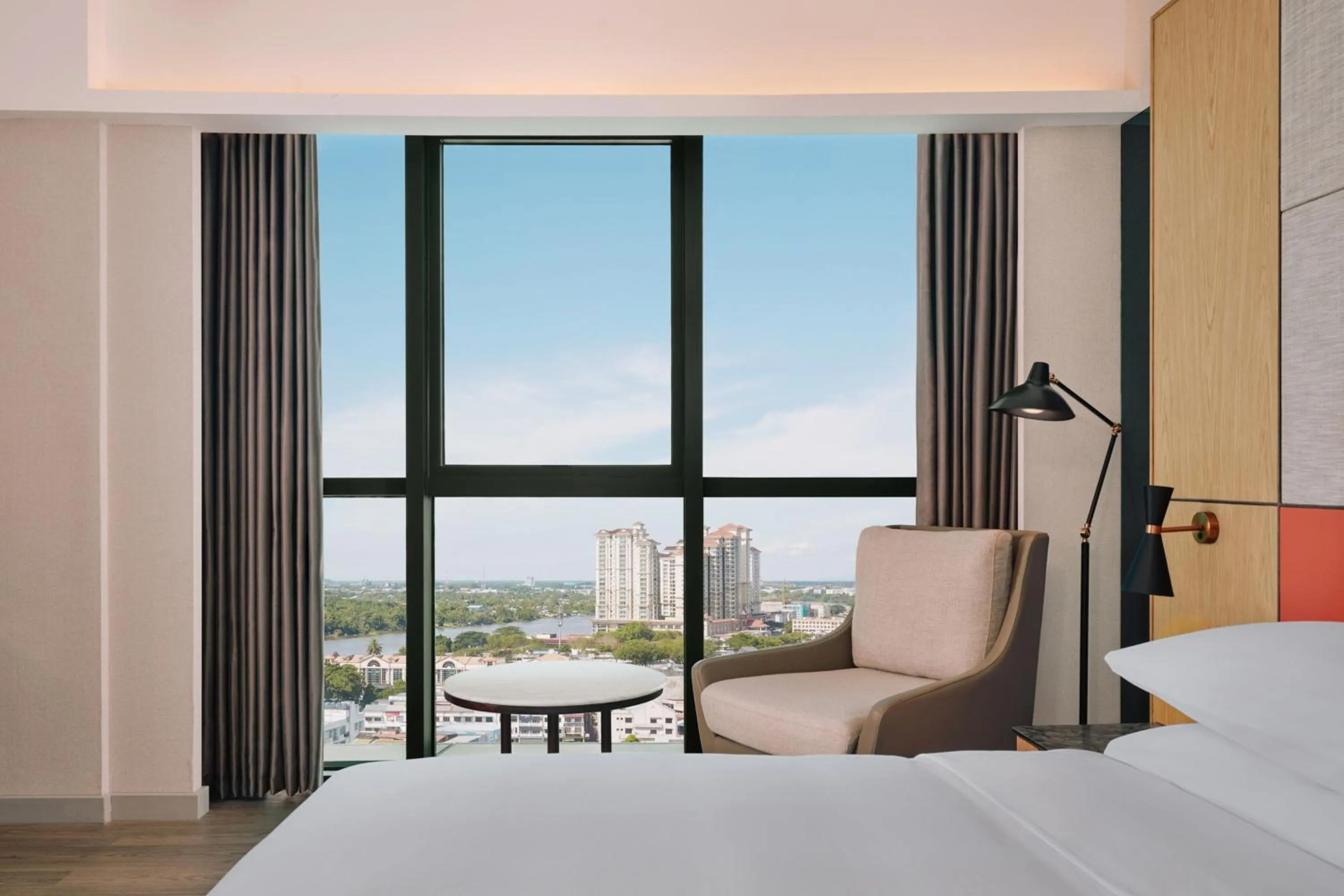 Photo of the whole room, Bed in Sheraton Kuching Hotel