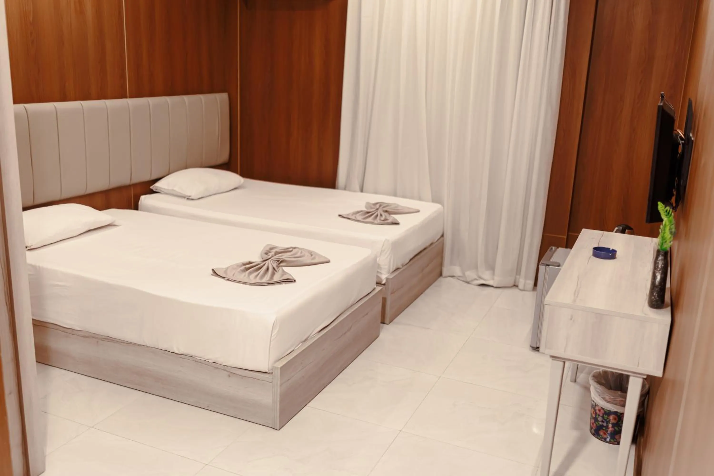 Bed in Royal Home Hotel