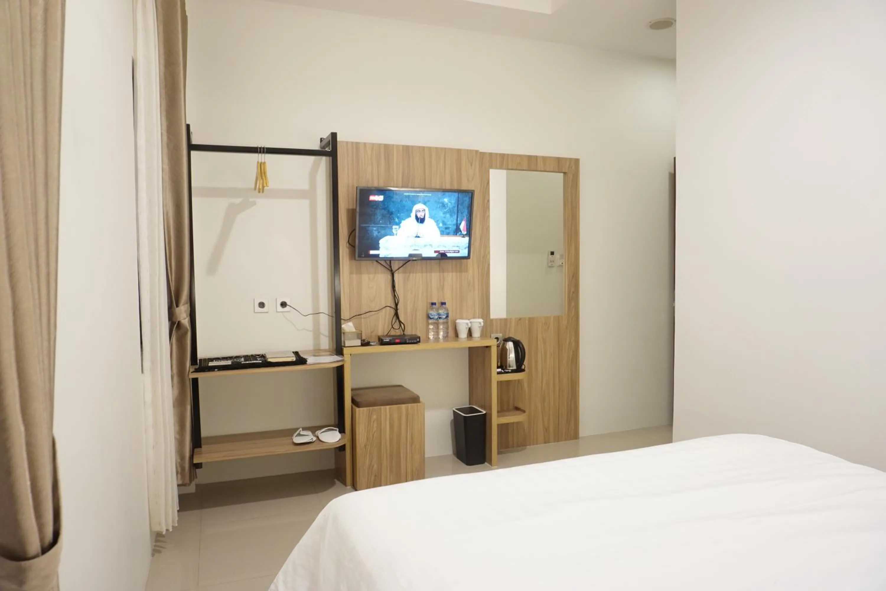 Bed in The Safiina Point Syariah Hotel