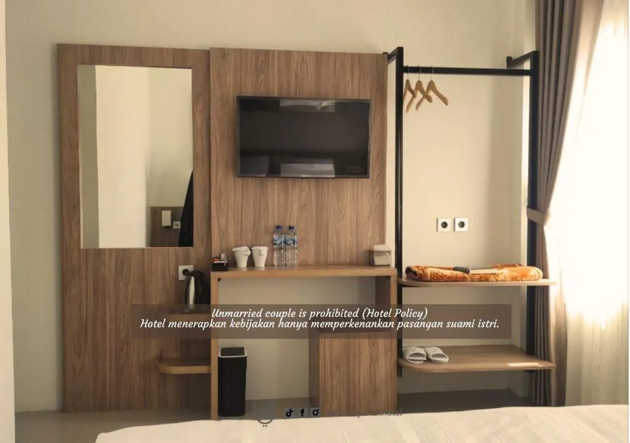 Bed in The Safiina Point Syariah Hotel