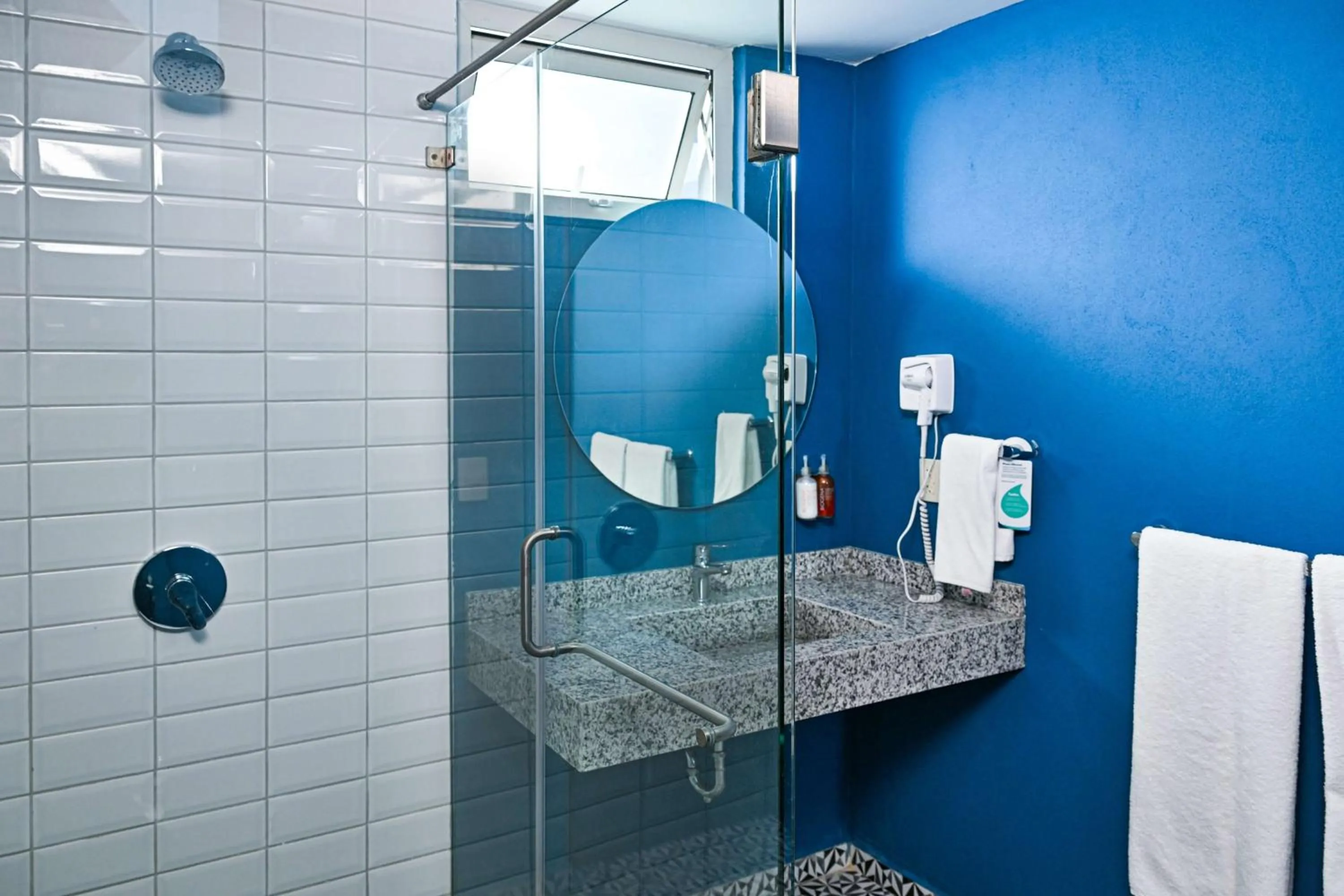 Bathroom in Vista Express Guadalajara Expo SureStay Collection by BW