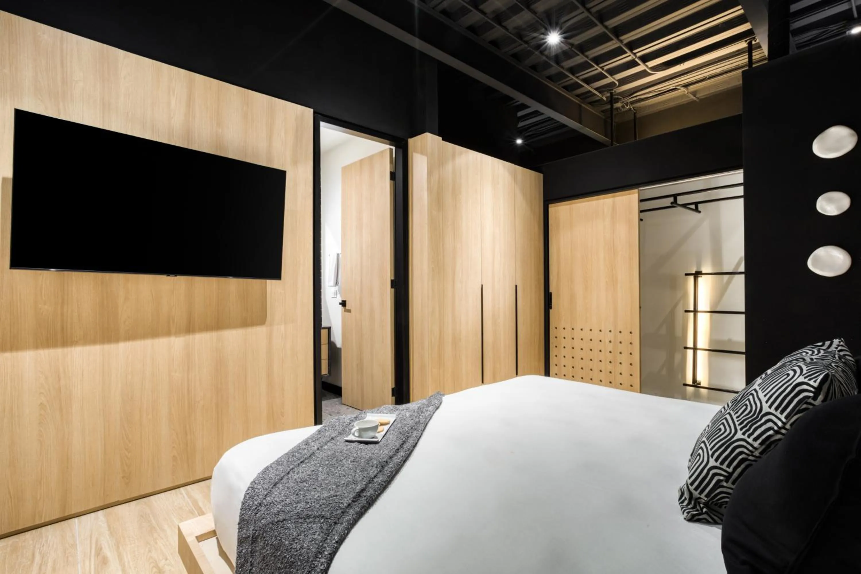 Bed in Downtown Designer Apartments by ULIV