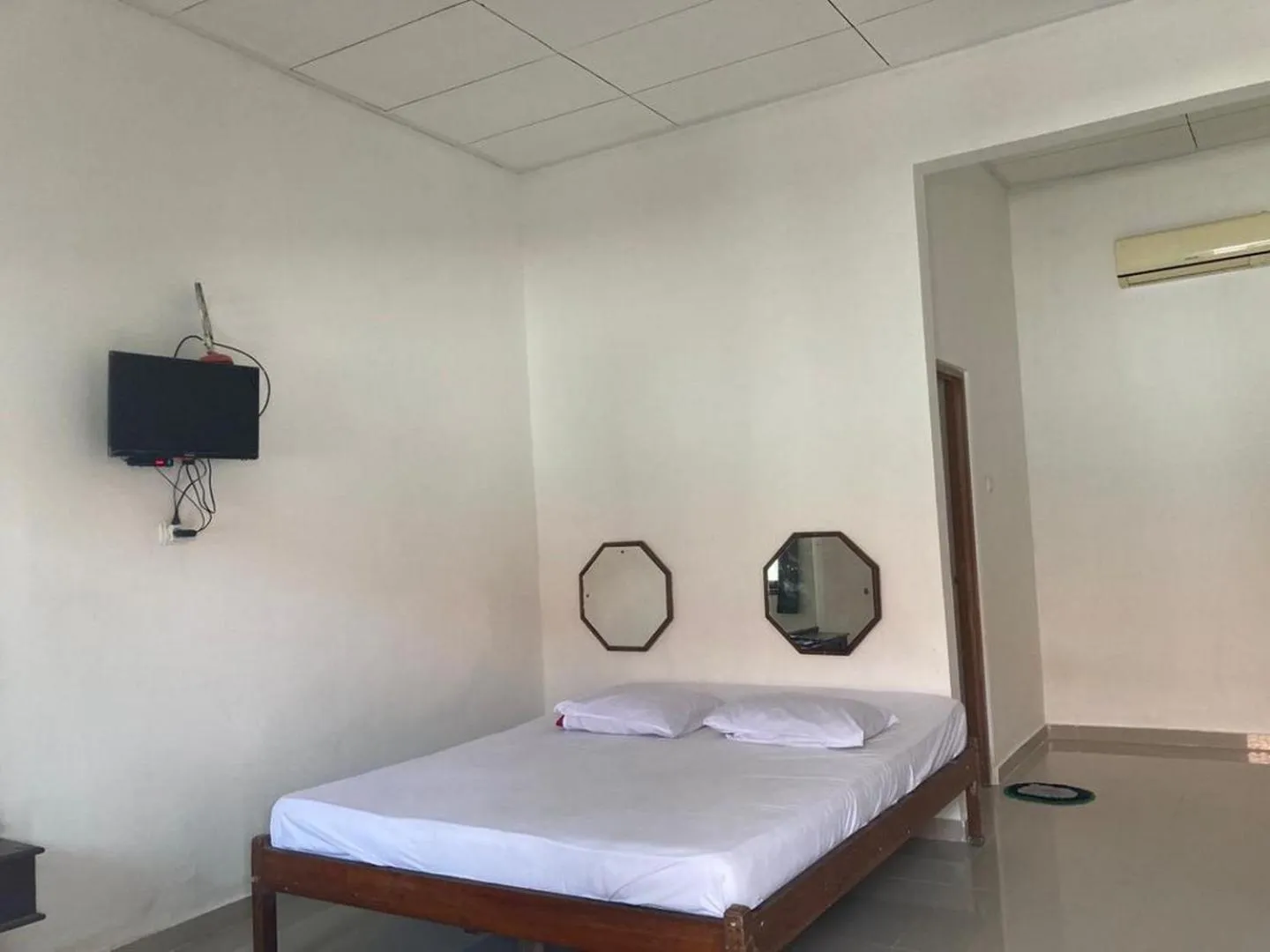 Bedroom, Bed in Hotel Surya Citra Jogja A Mitra RedDoorz