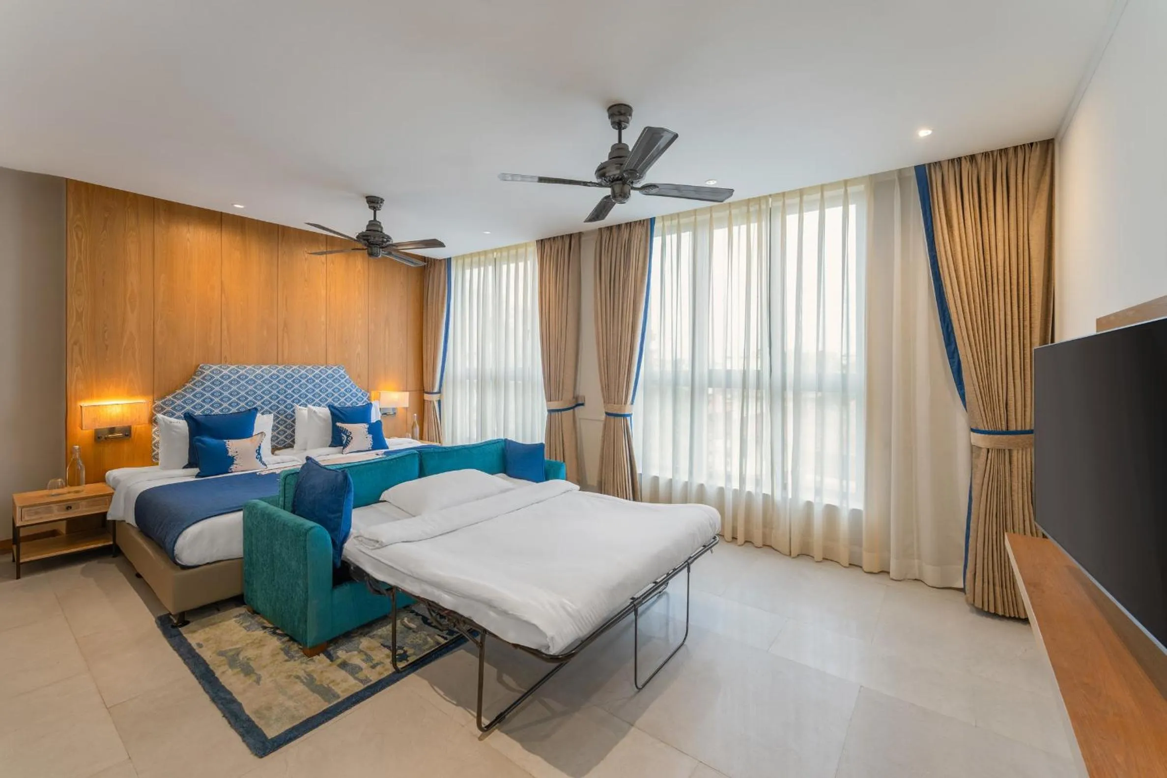 Bed in The Astor - All Suites Hotel Candolim Goa