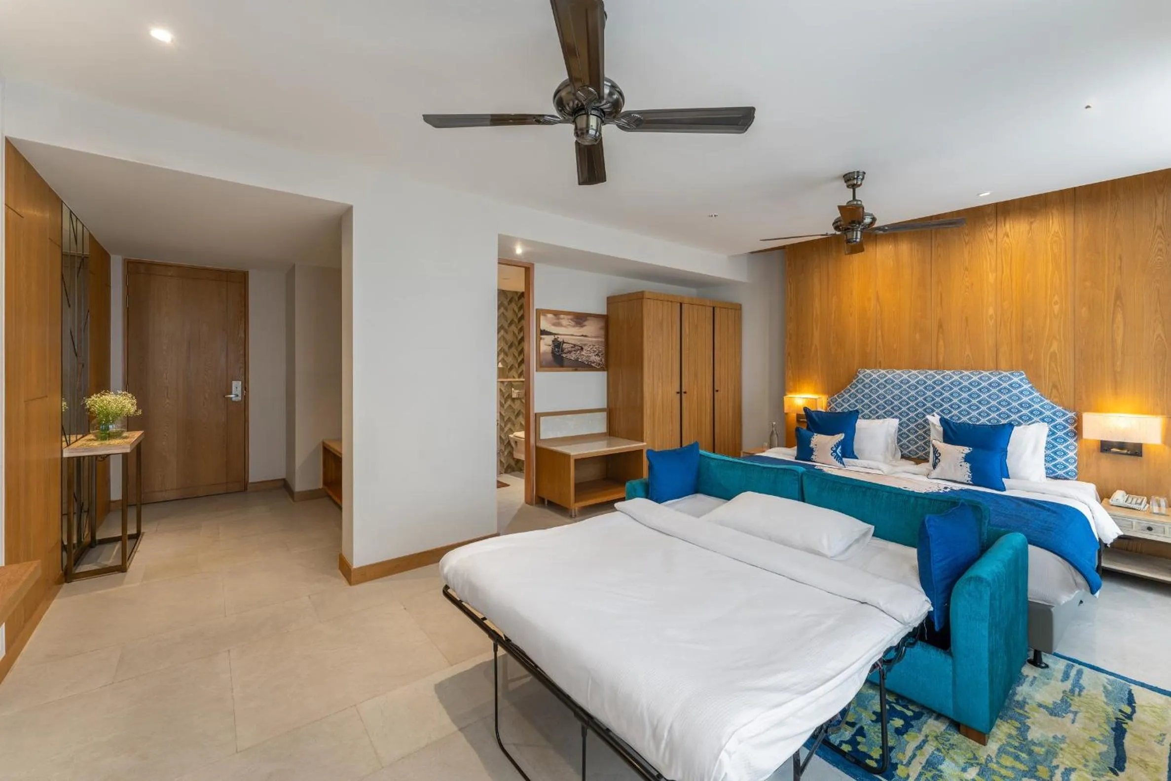 Bed in The Astor - All Suites Hotel Candolim Goa