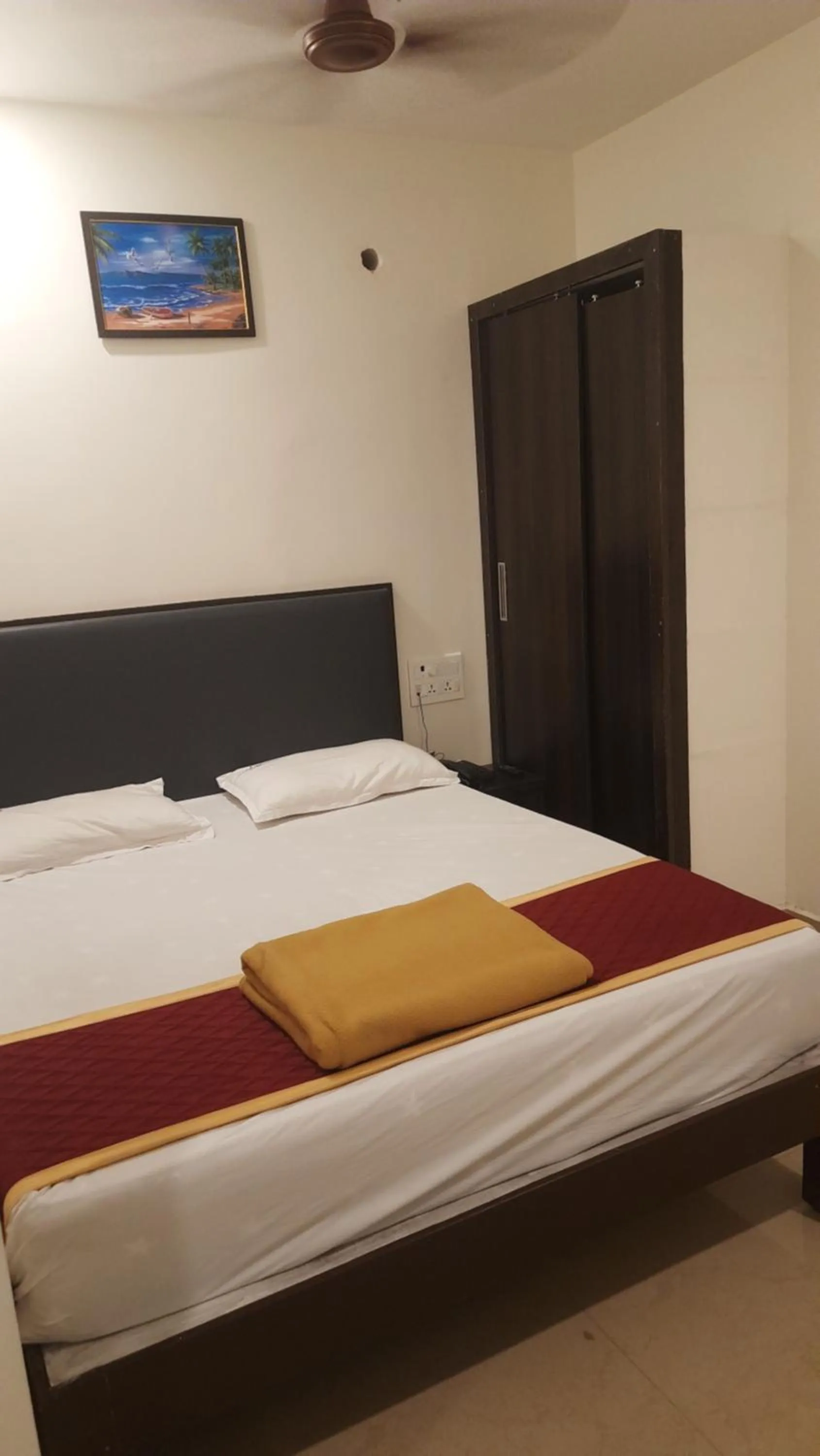 Bed in Hotel Sitar Grand