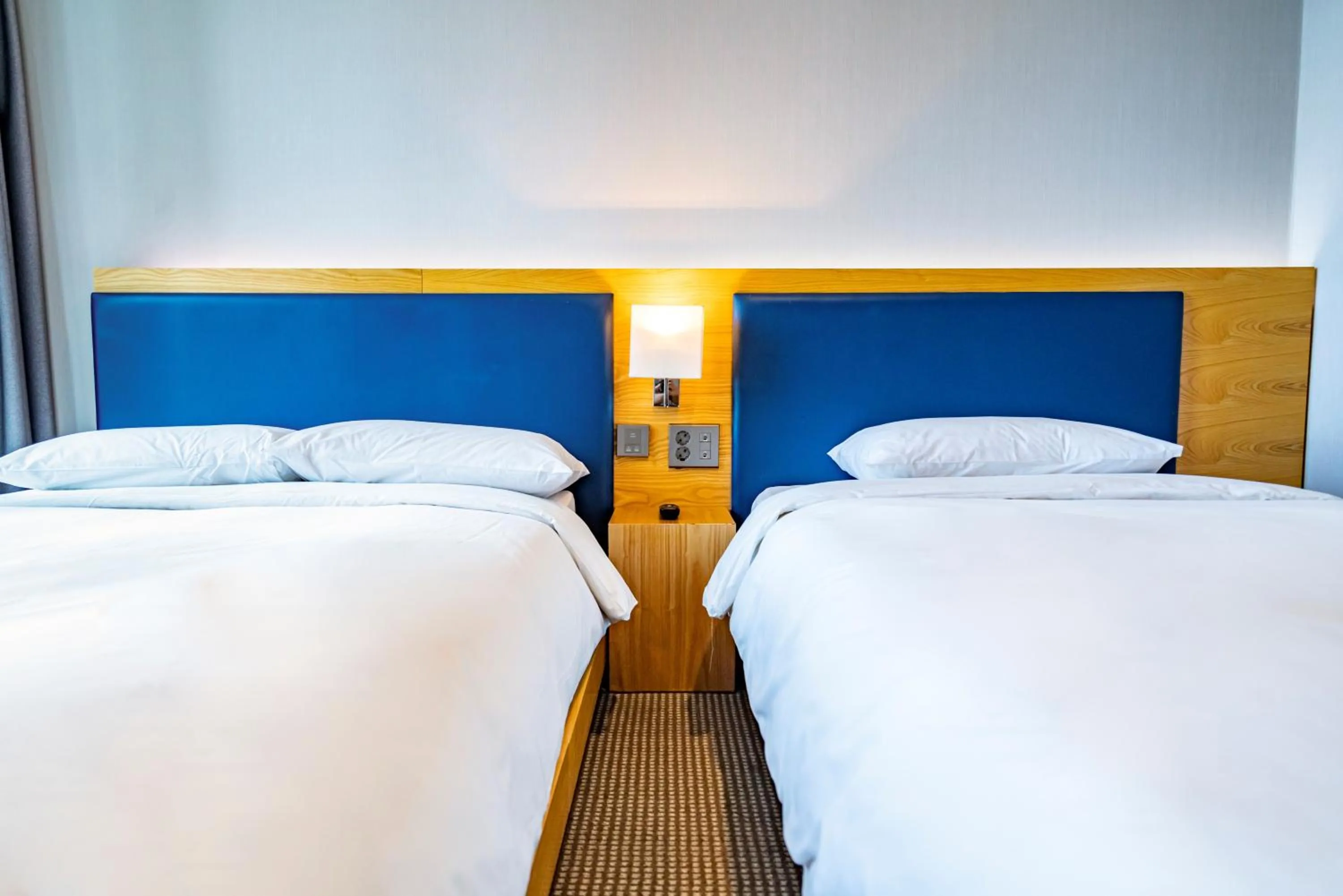 Bed in Centum Business Hotel