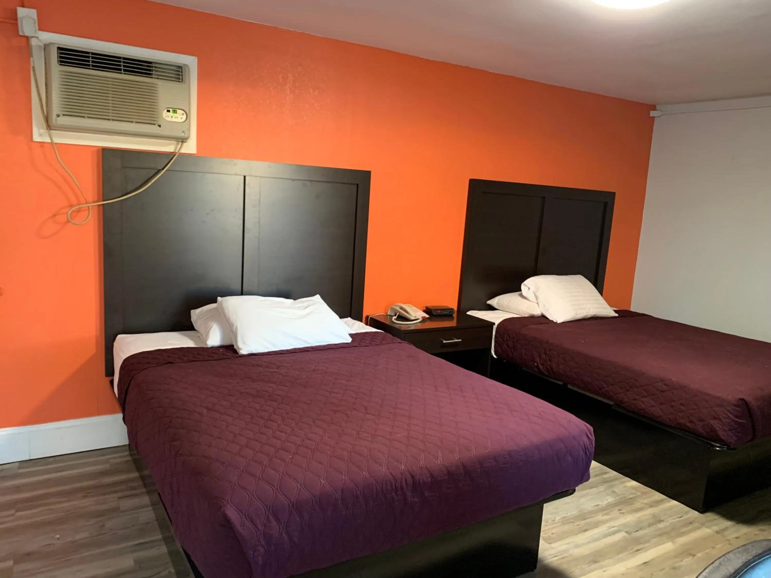 Bed in Whispering Pines Motel