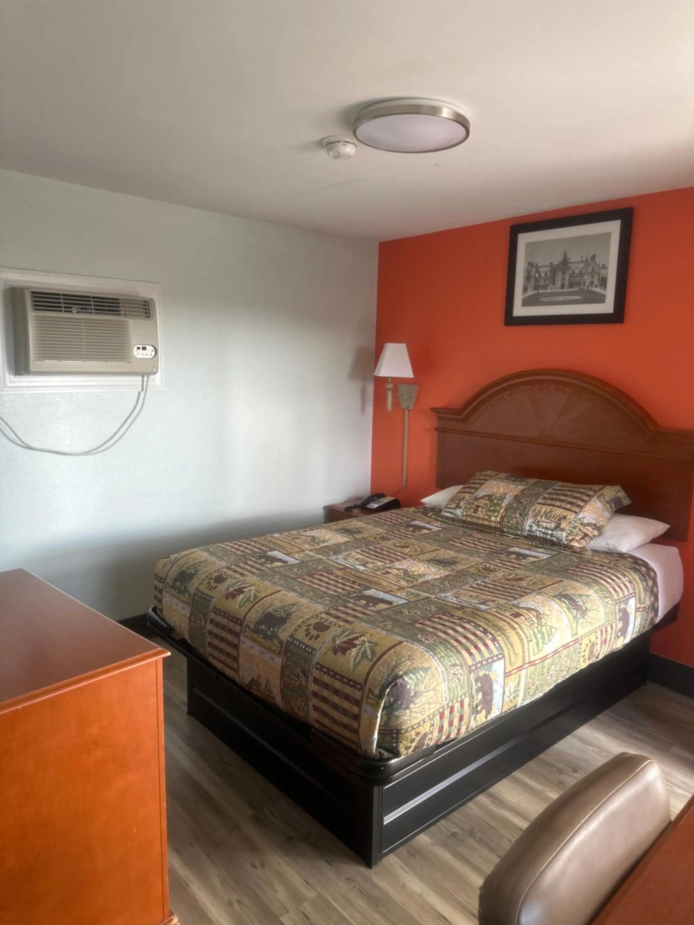 Bed in Whispering Pines Motel