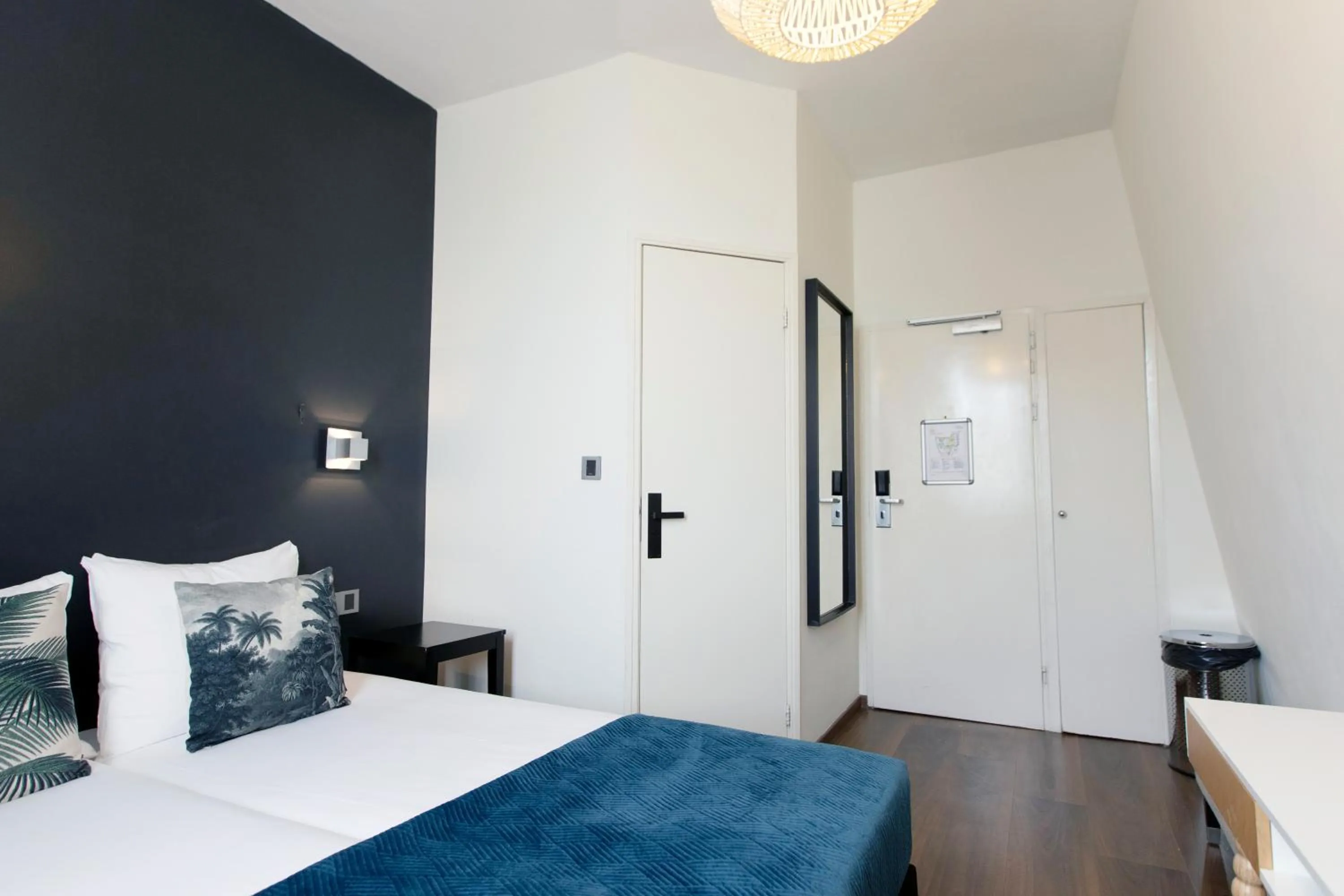 Bed in Quentin Amsterdam Hotel