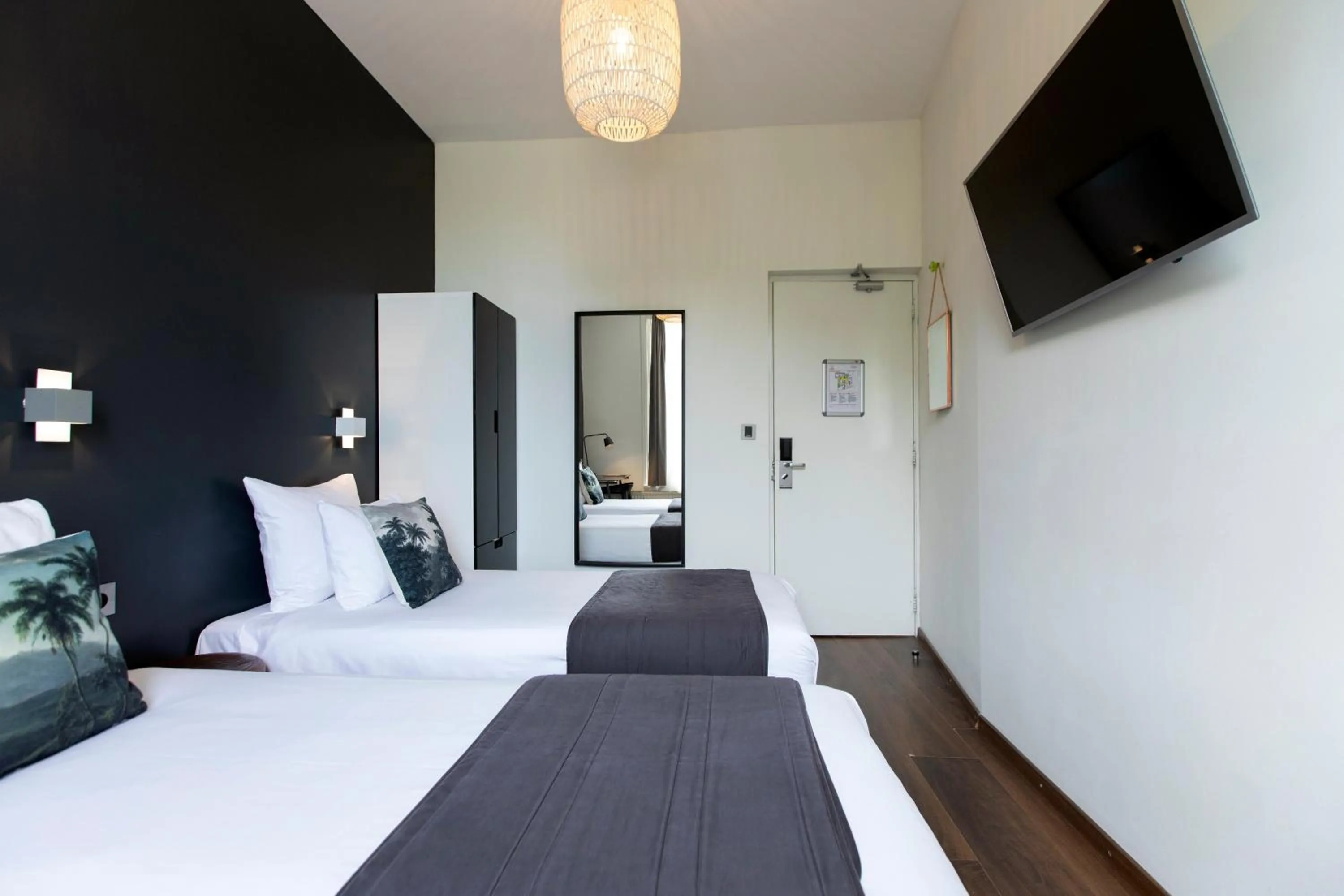 Bed in Quentin Amsterdam Hotel