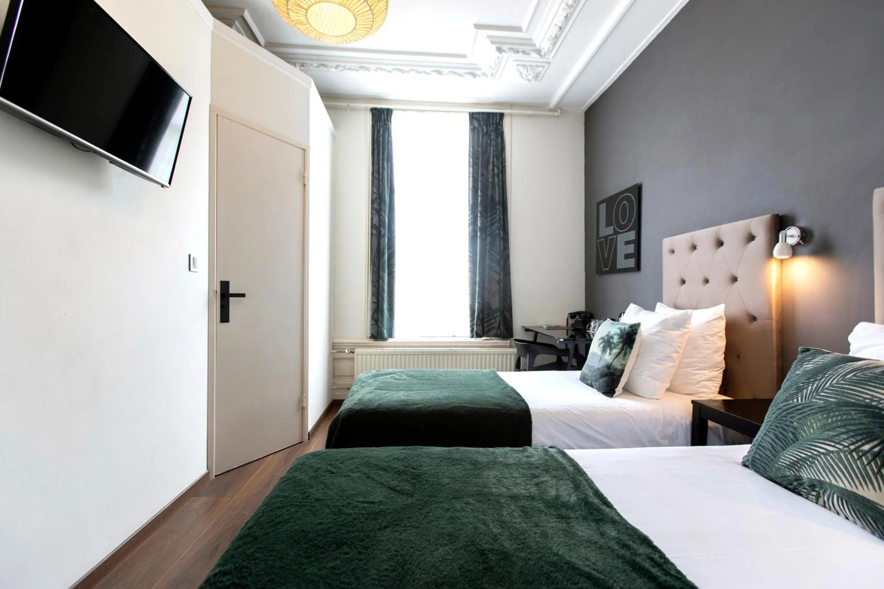 Bed in Quentin Amsterdam Hotel