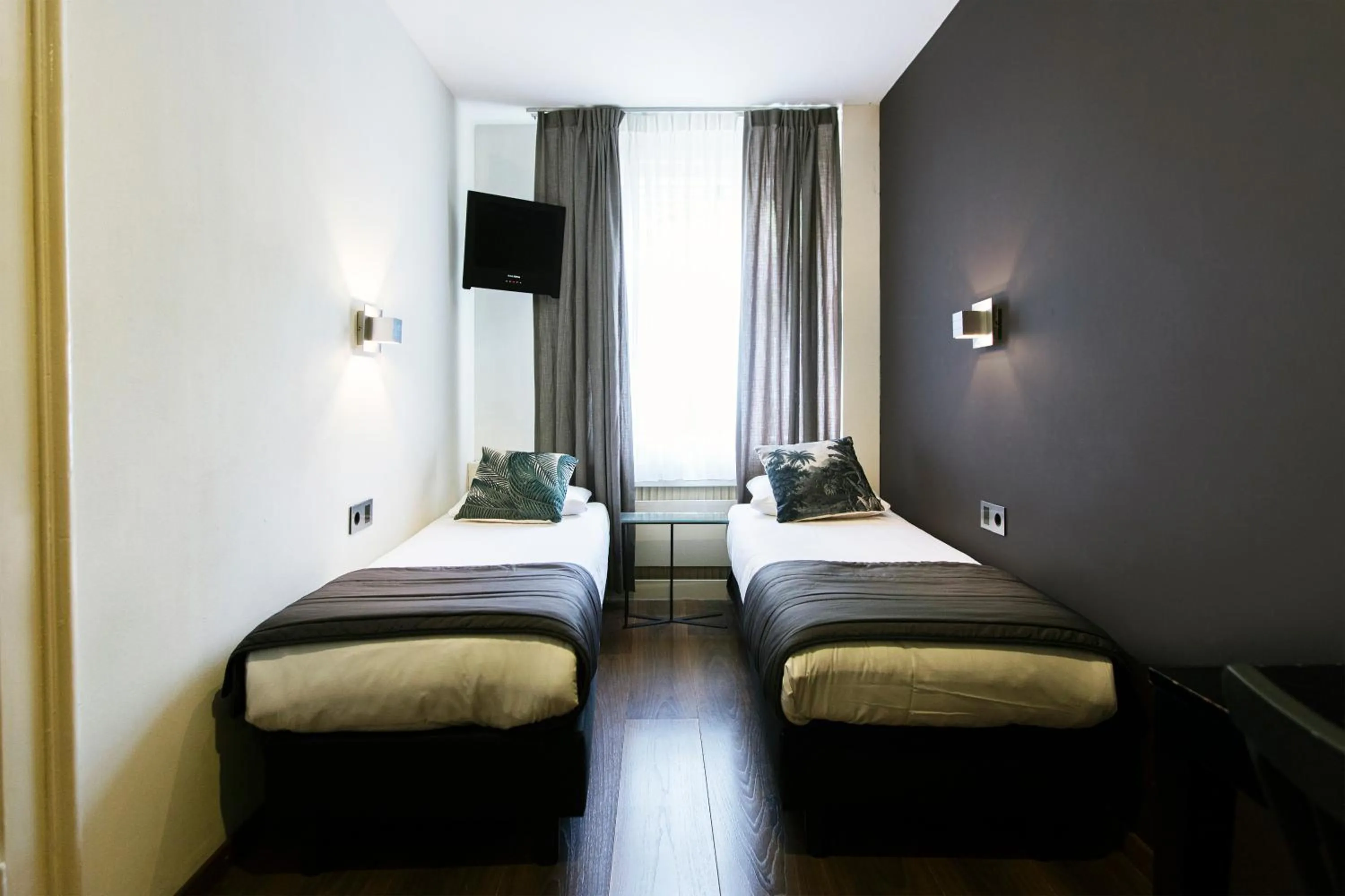 Bed in Quentin Amsterdam Hotel