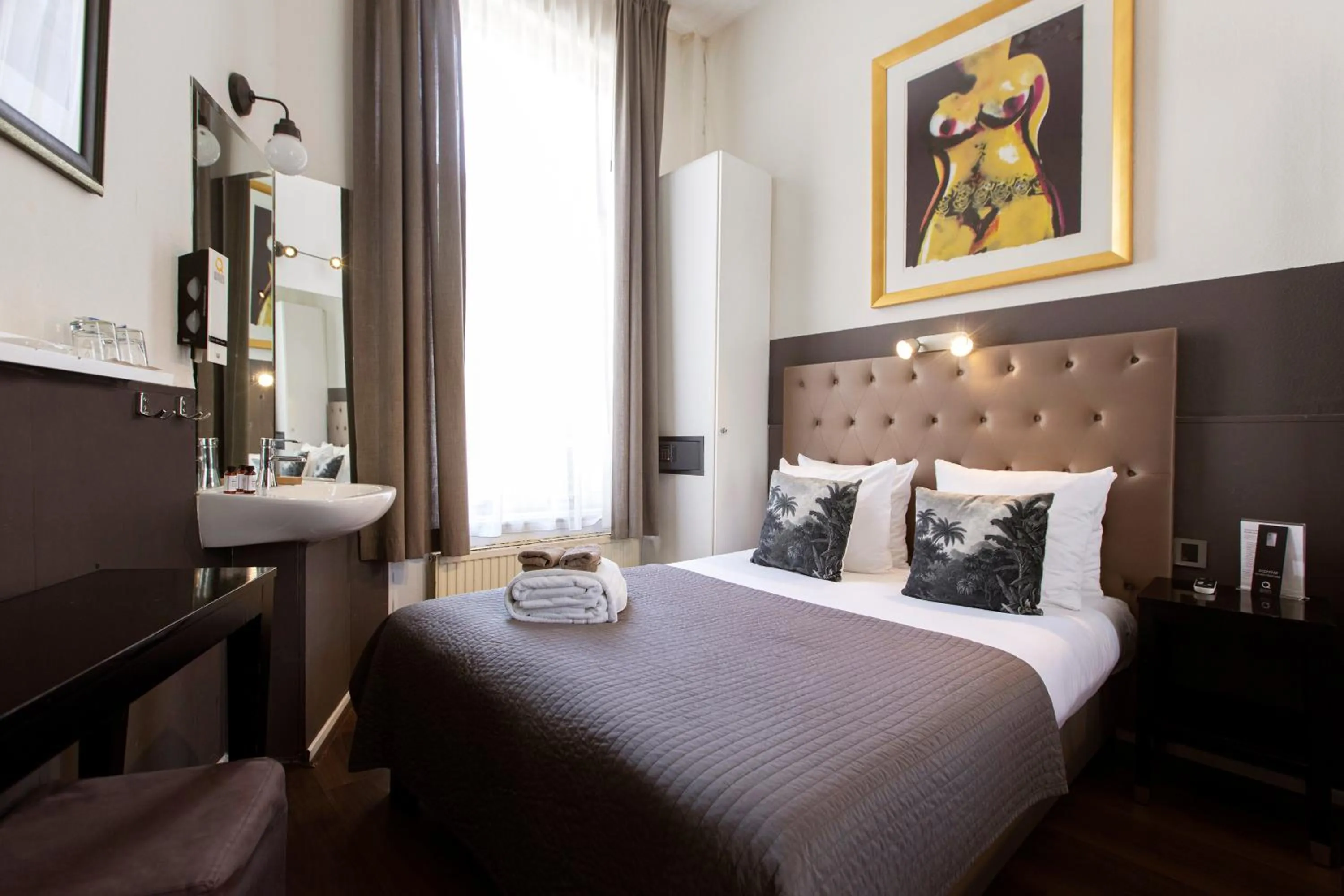 Bed in Quentin Amsterdam Hotel