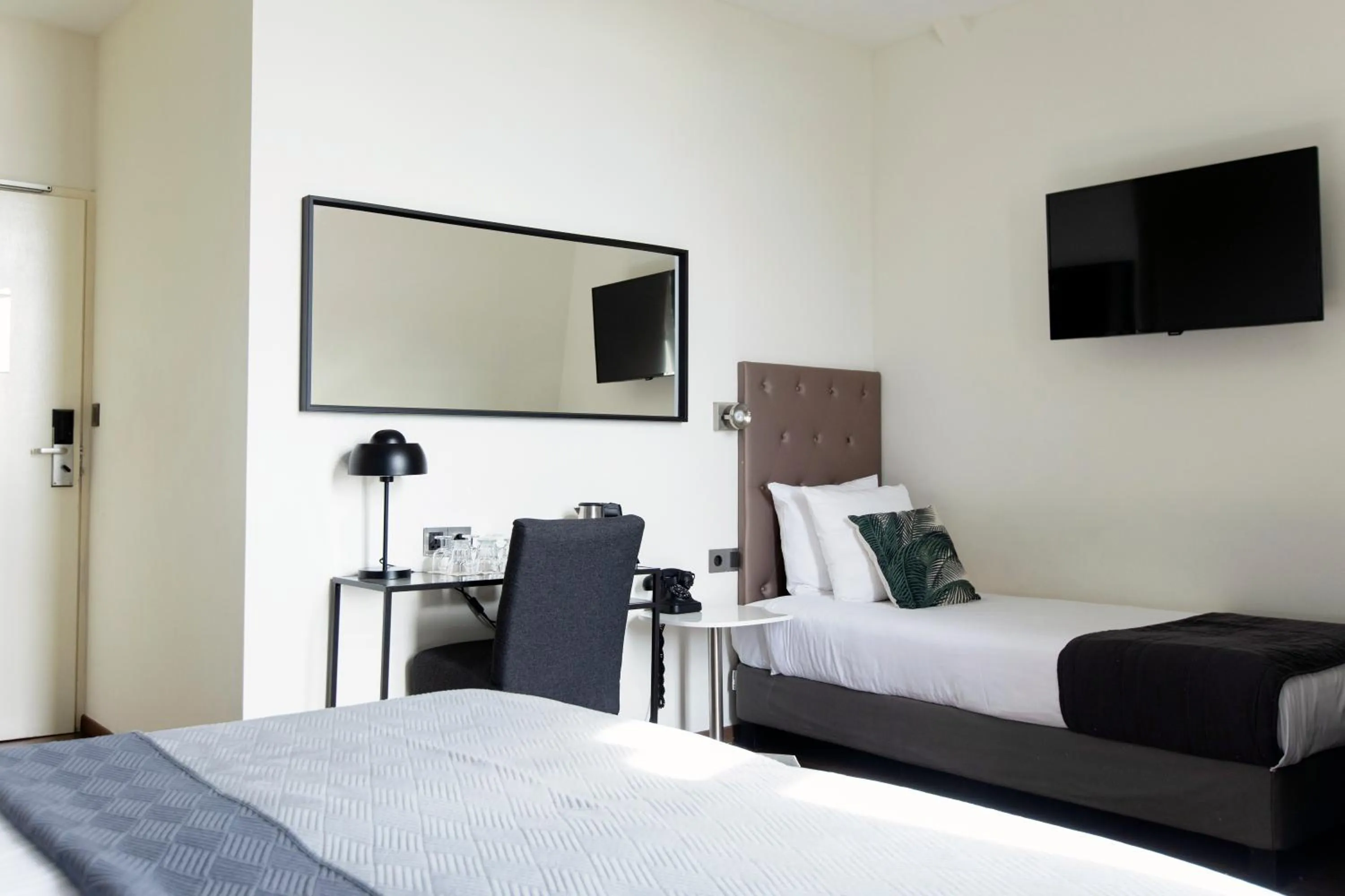 Bed in Quentin Amsterdam Hotel