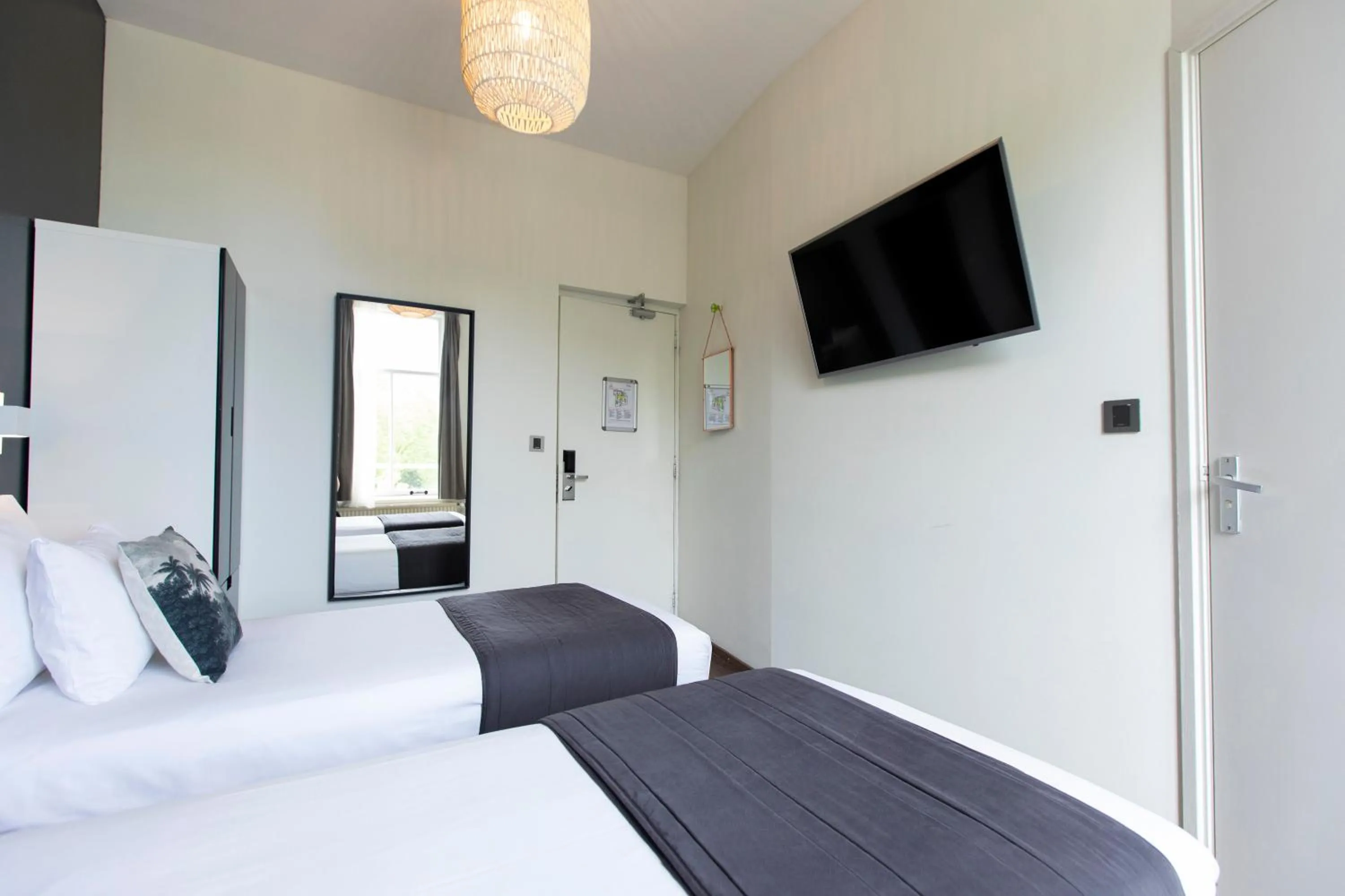 Bed in Quentin Amsterdam Hotel