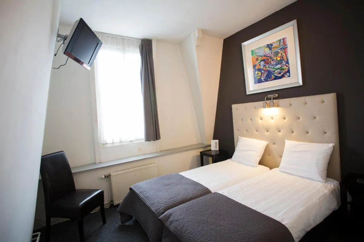 Bed in Quentin Amsterdam Hotel