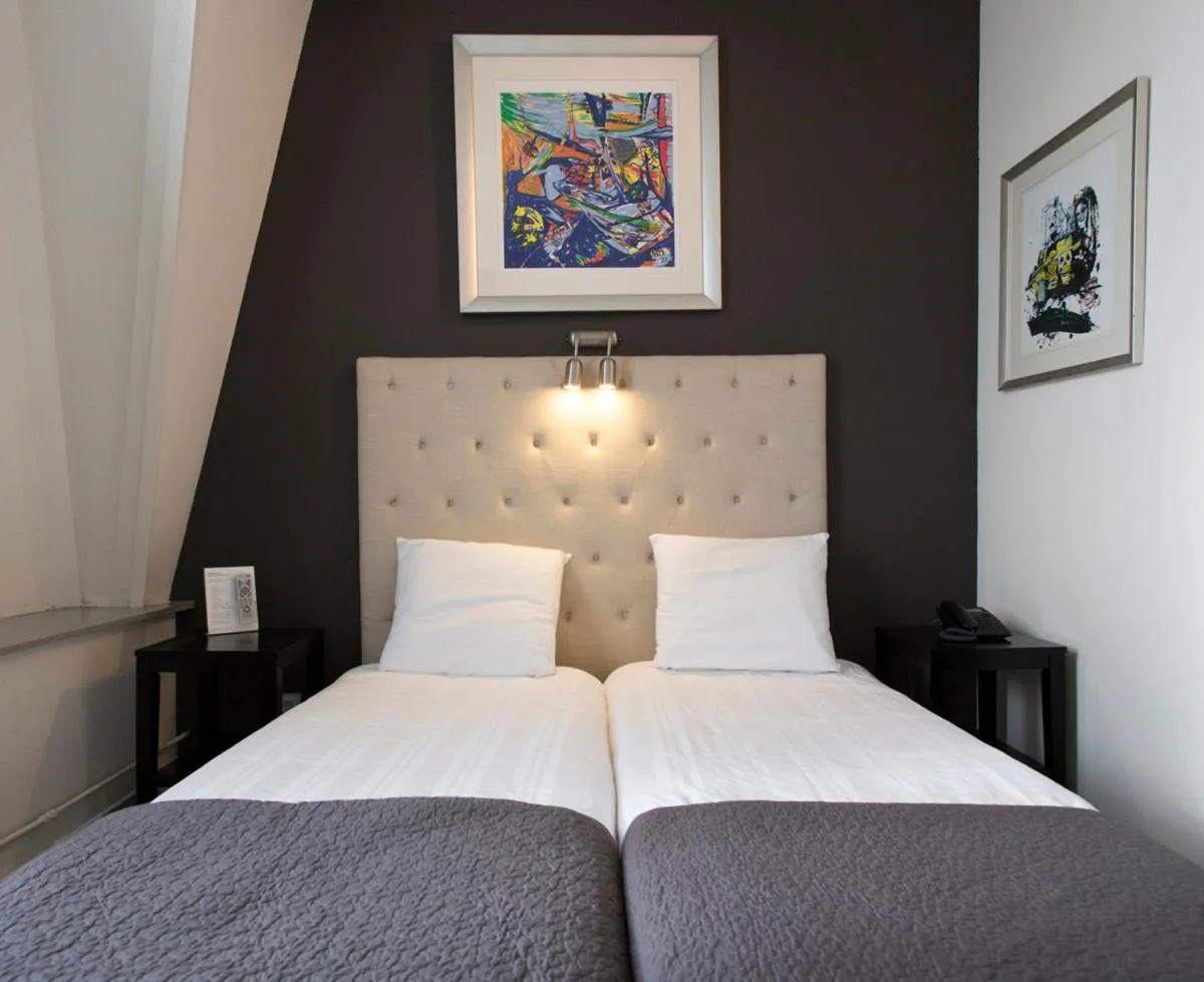 Bed in Quentin Amsterdam Hotel