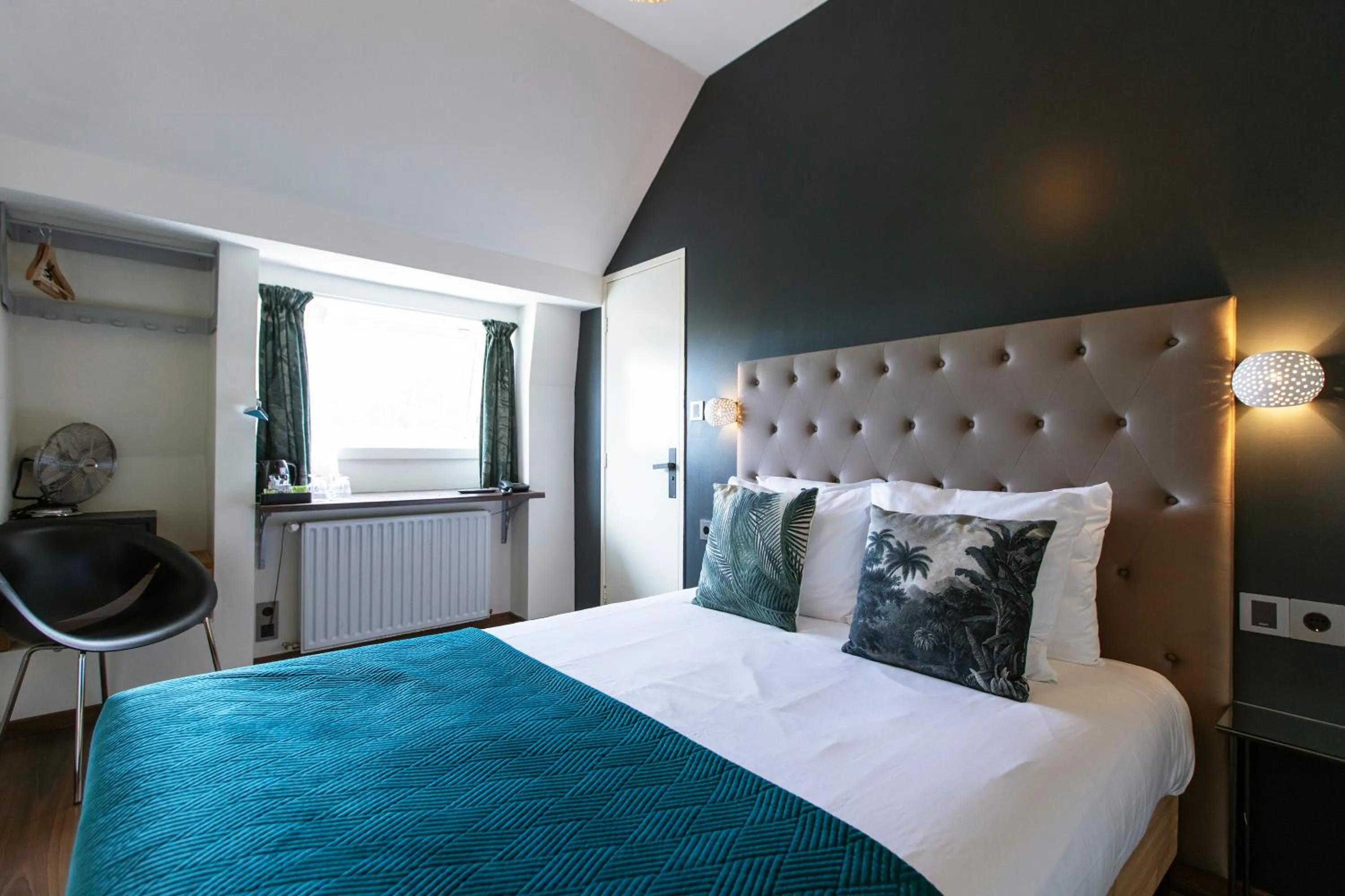 Bed in Quentin Amsterdam Hotel