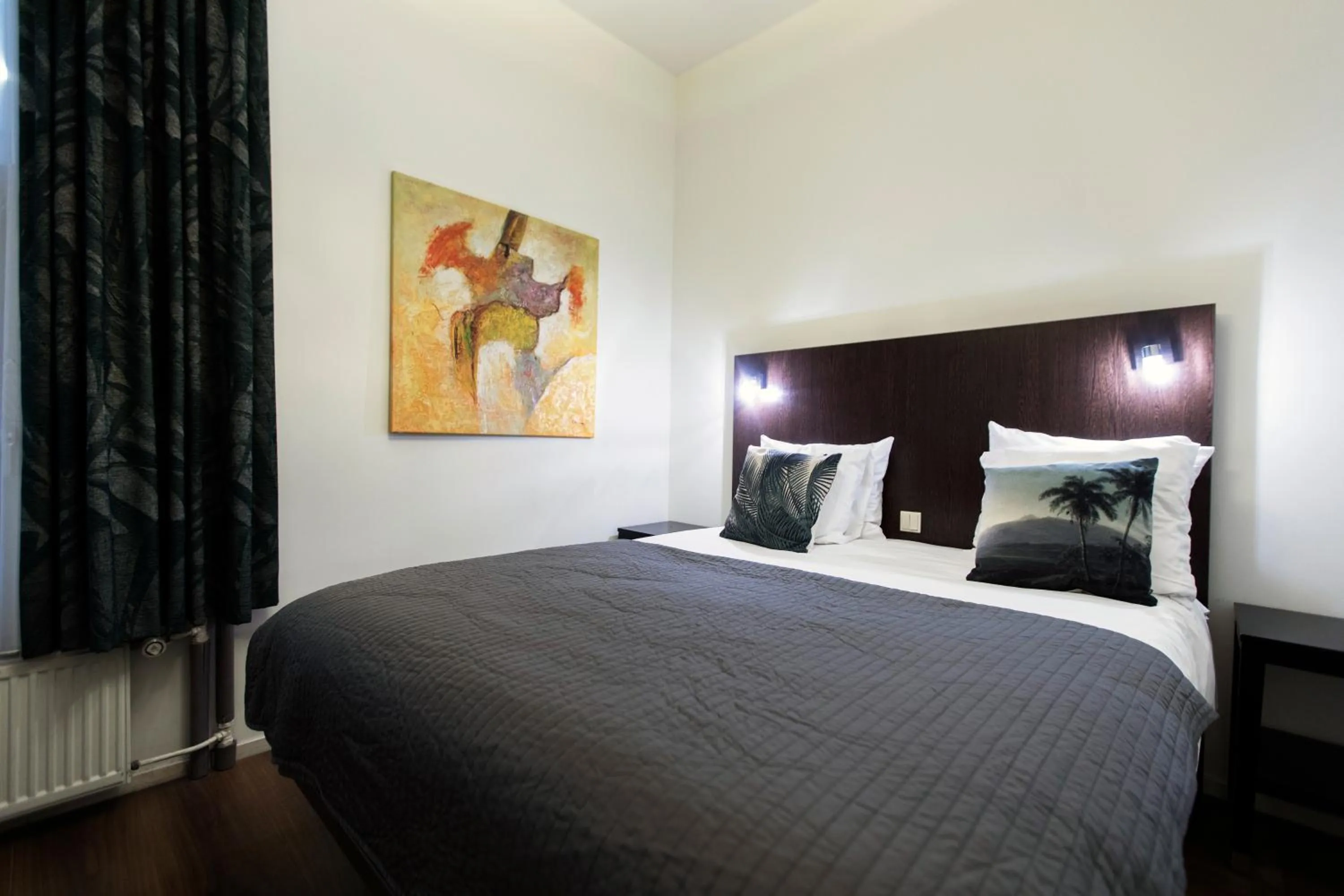 Bed in Quentin Amsterdam Hotel