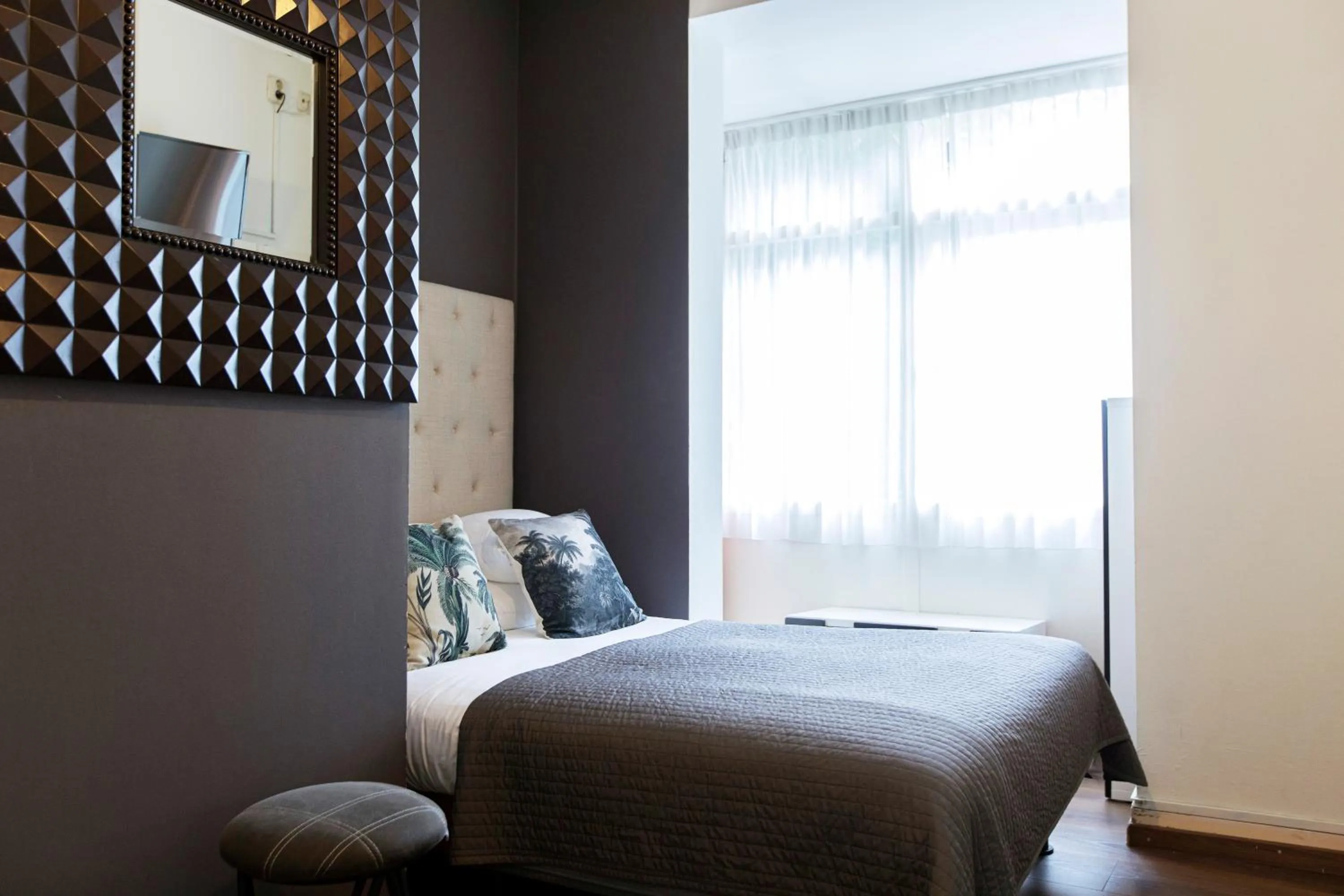 Bed in Quentin Amsterdam Hotel