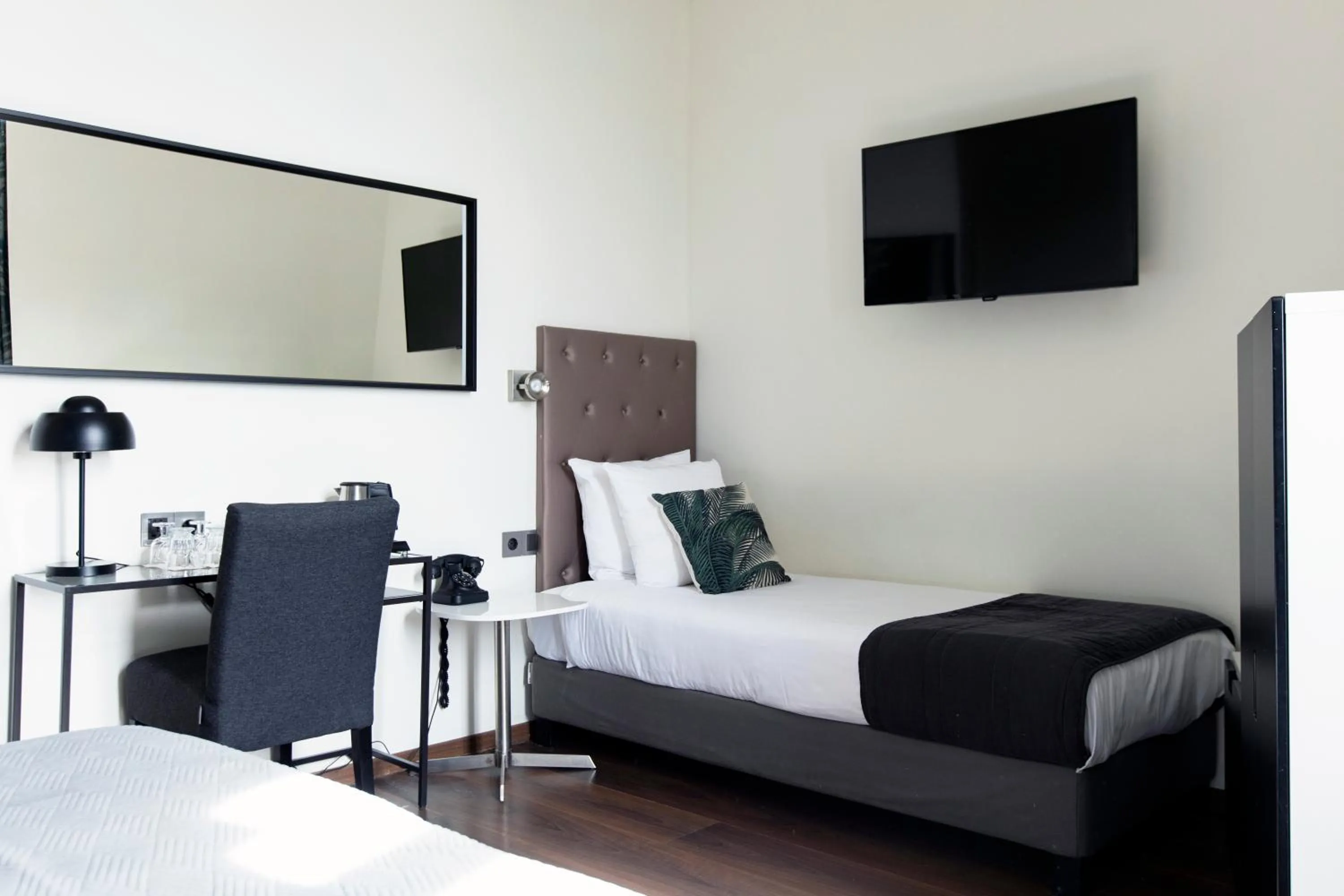 Bed in Quentin Amsterdam Hotel