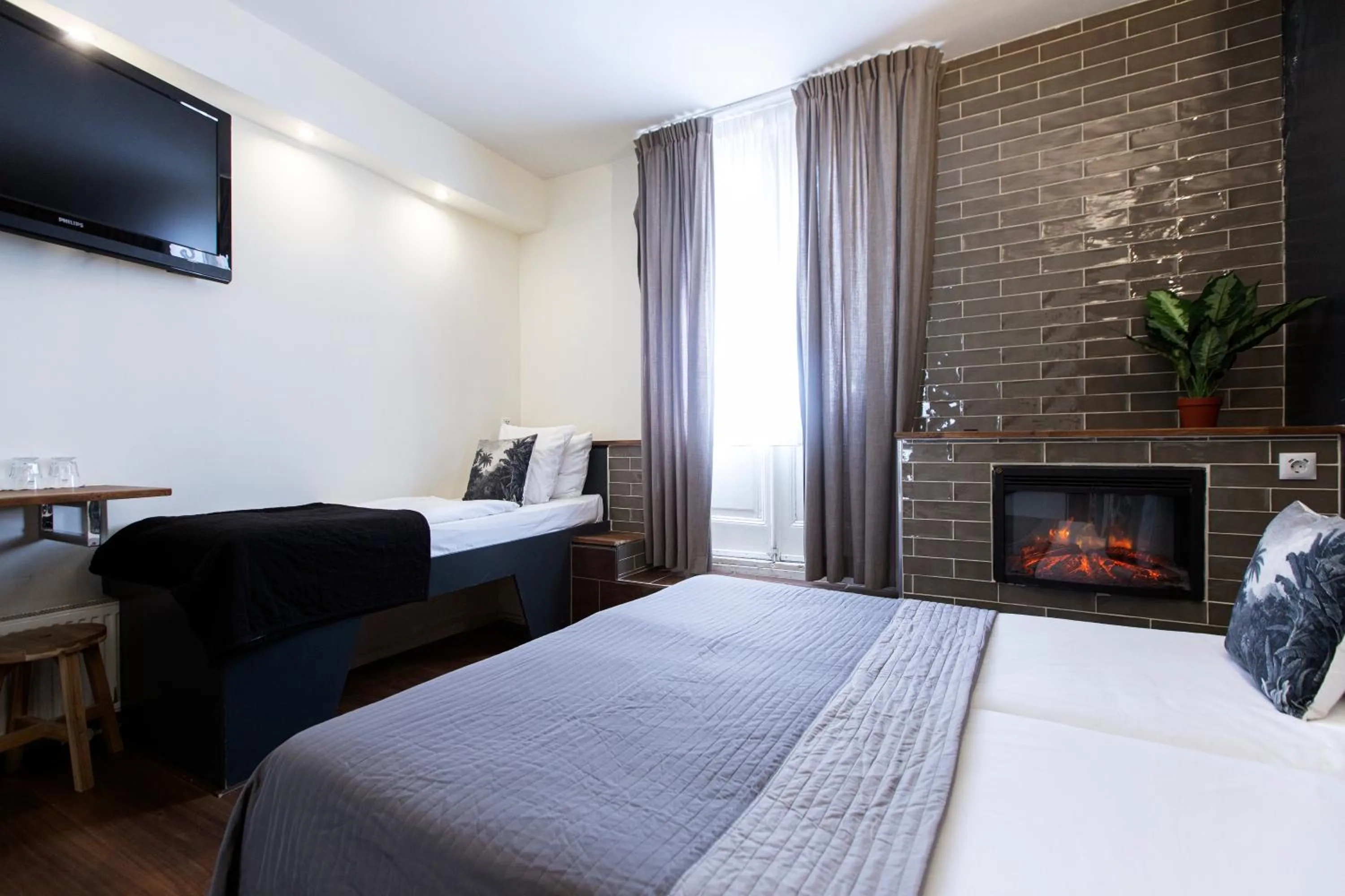 Bed in Quentin Amsterdam Hotel