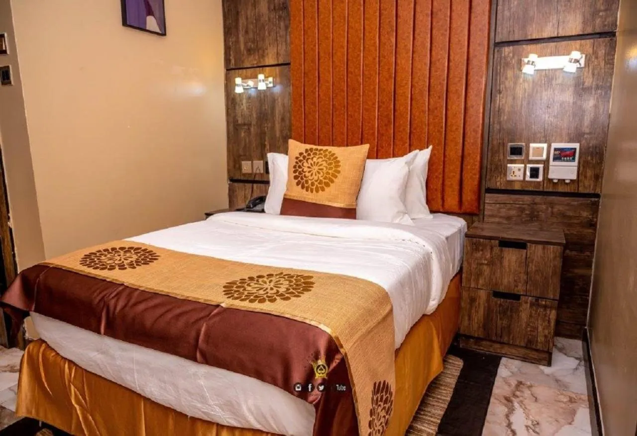 Bed in Joker Hotel and Suites