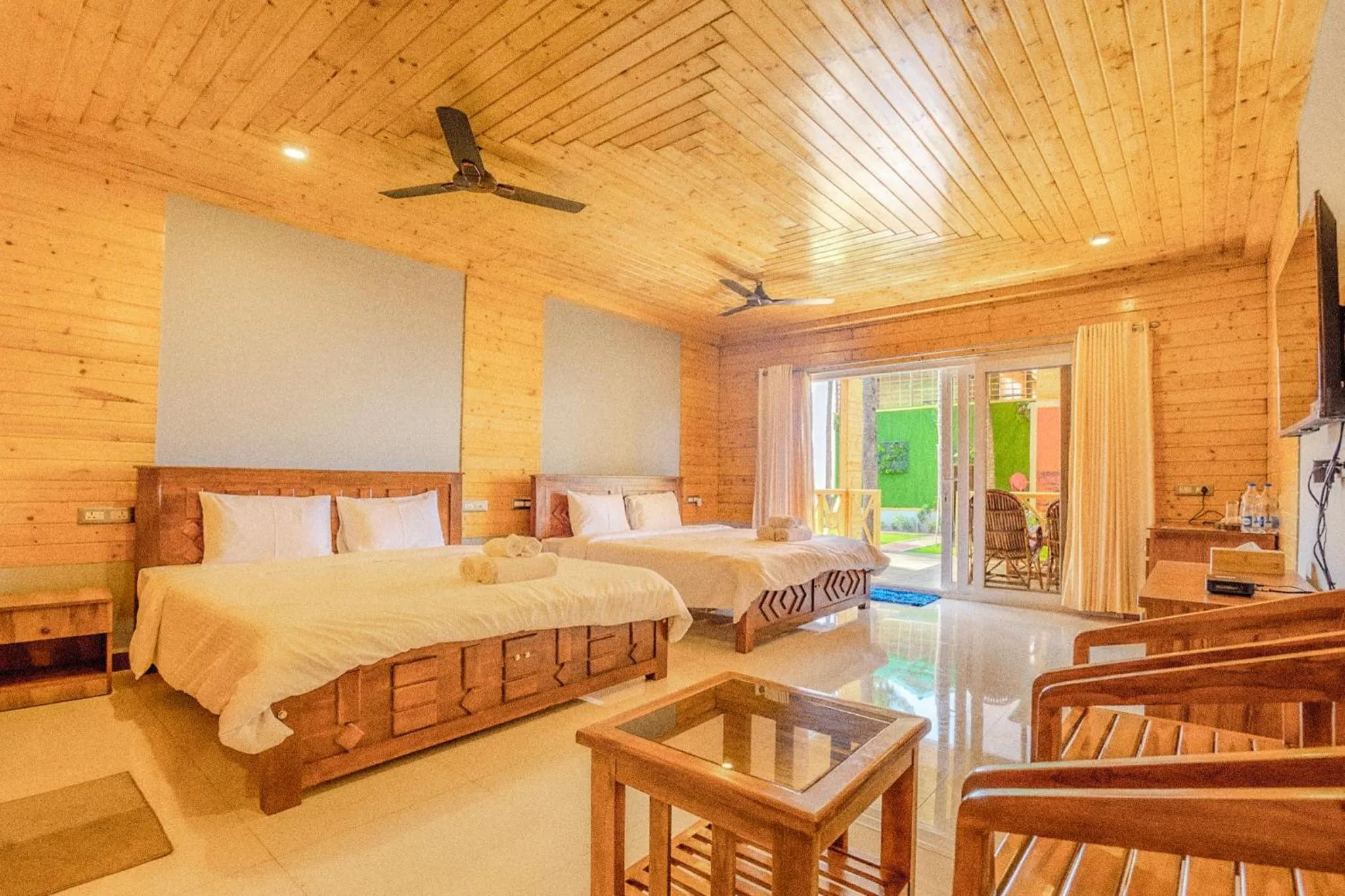 Communal lounge/ TV room, Bed in The O2H Agonda Beach Resort