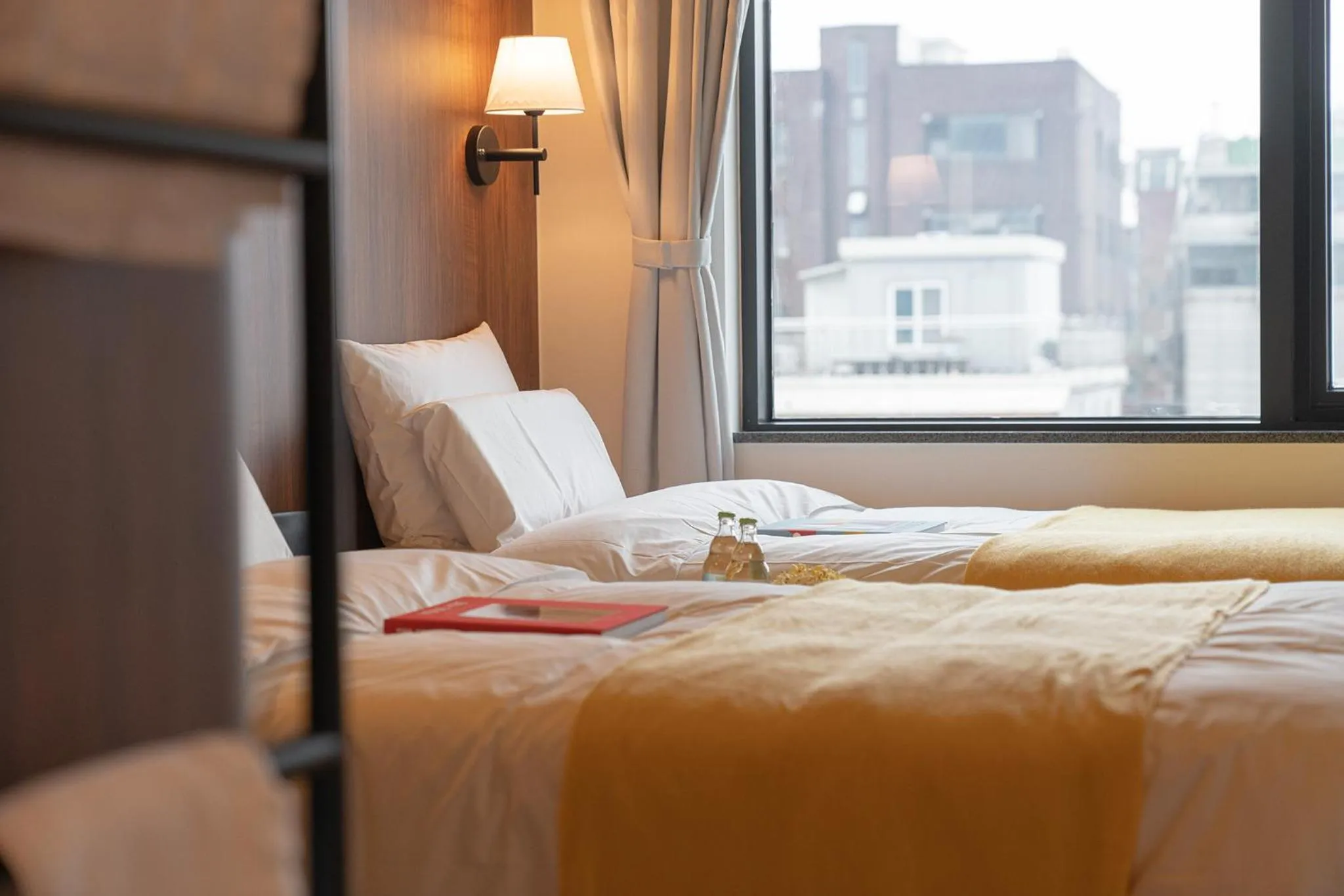 Bed in Nouvelle Hotel Seoul Itaewon by Aank