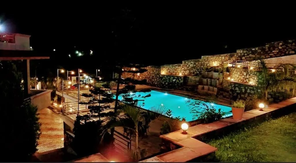 Swimming pool in Meera Valley Resort By Nexottel