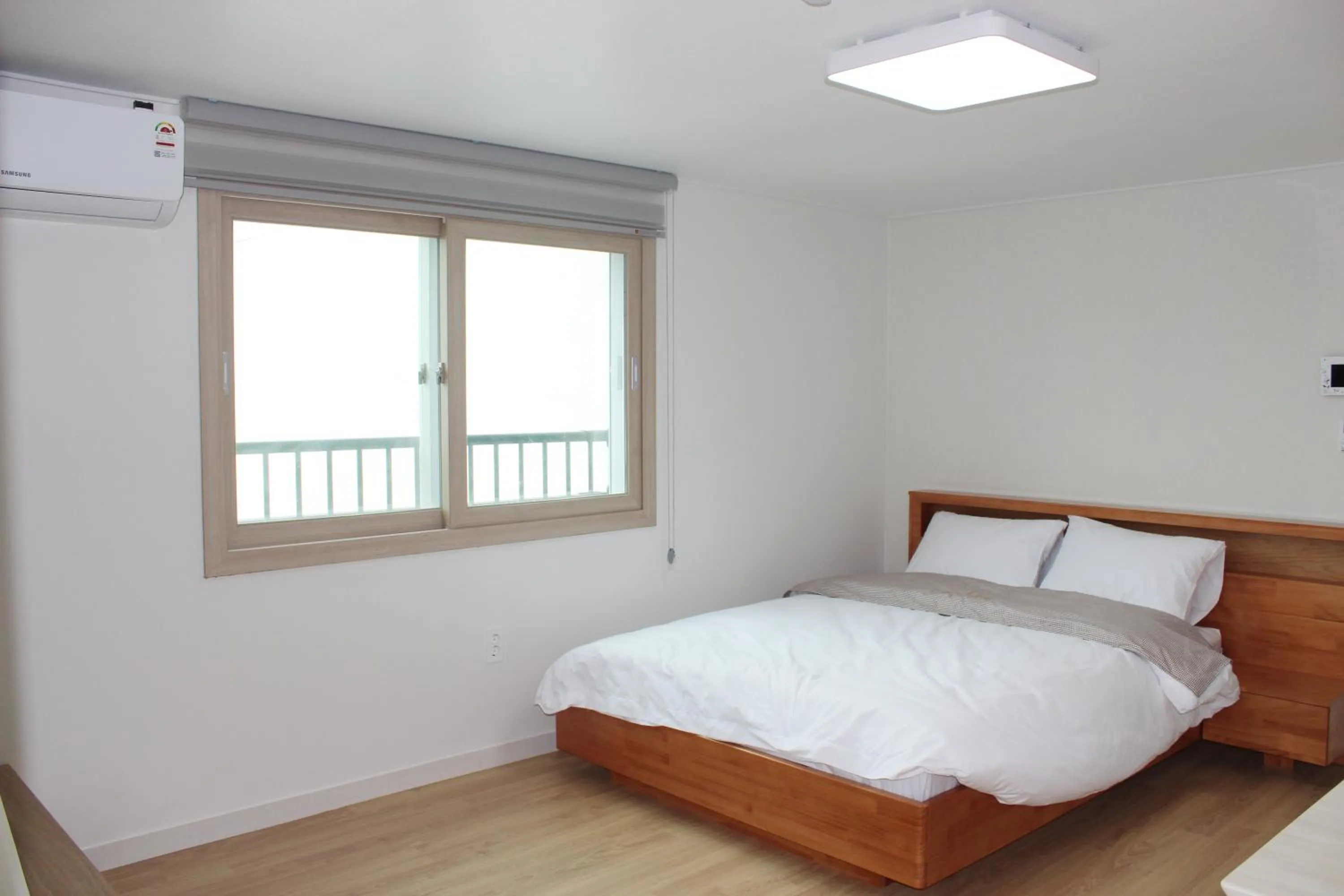 Bed in Jeju Aria Pension