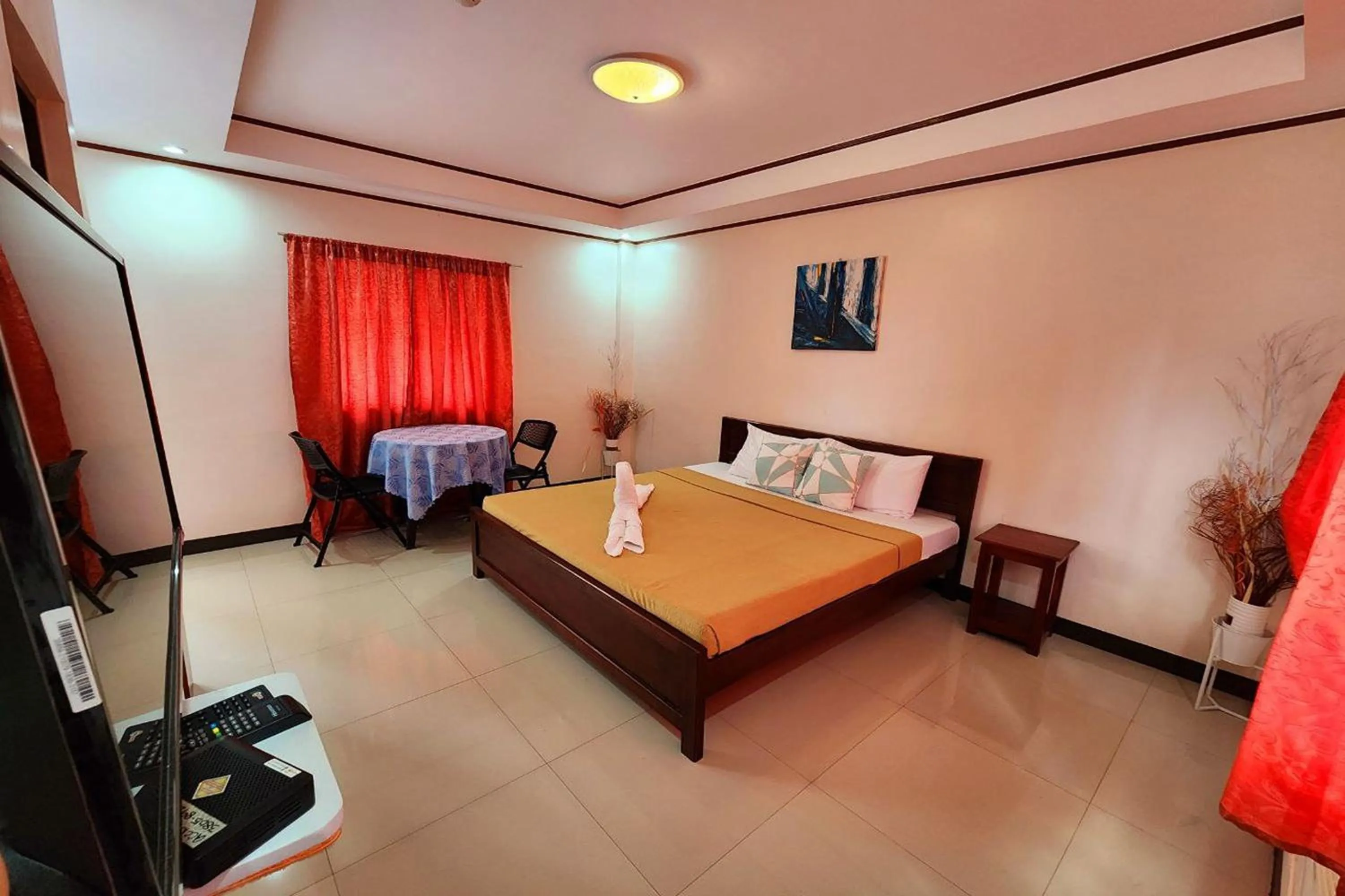 Bedroom, Bed in Dinah's Tourist Inn Puerto Princesa