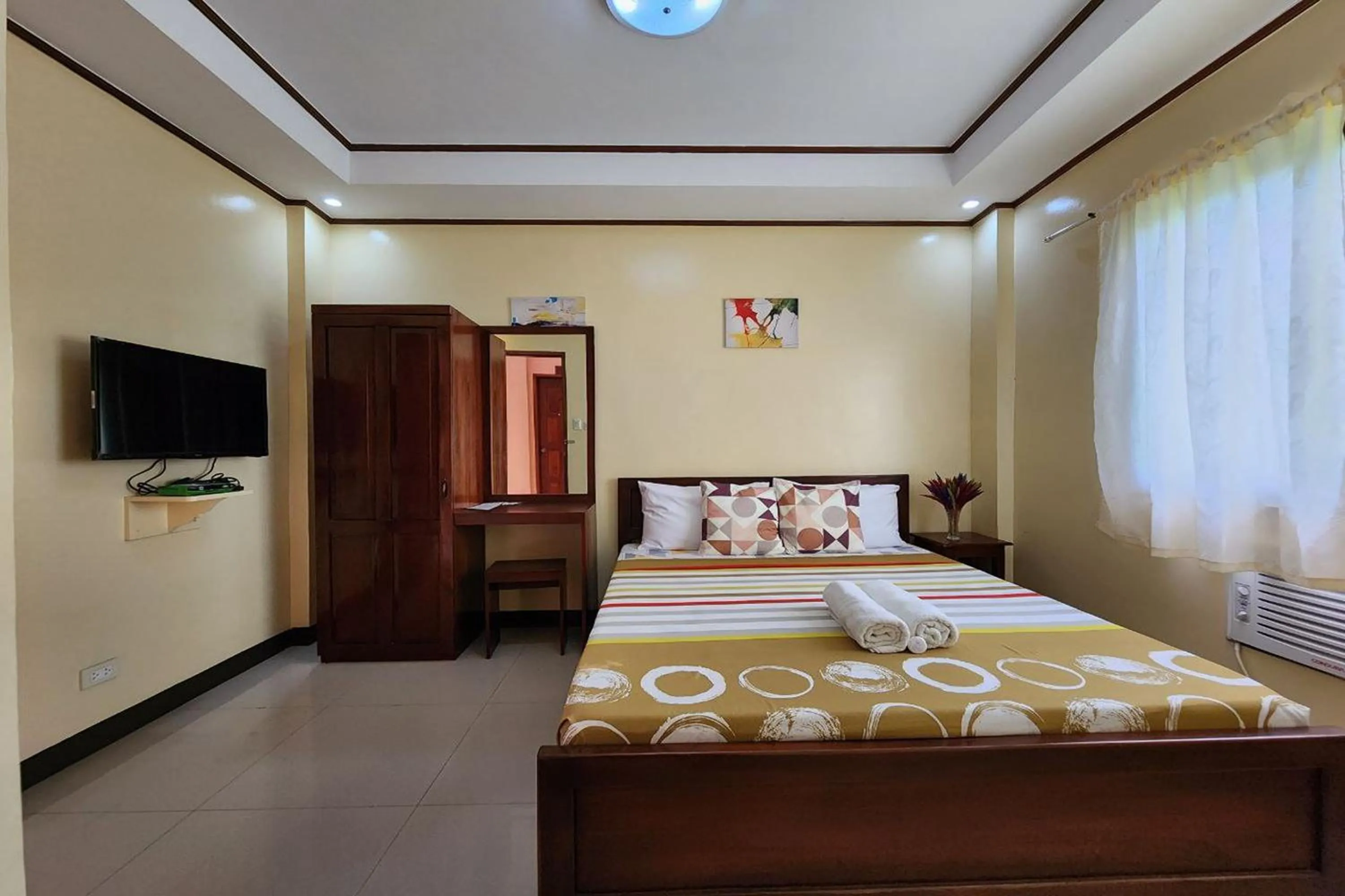 Bed in Dinah's Tourist Inn Puerto Princesa