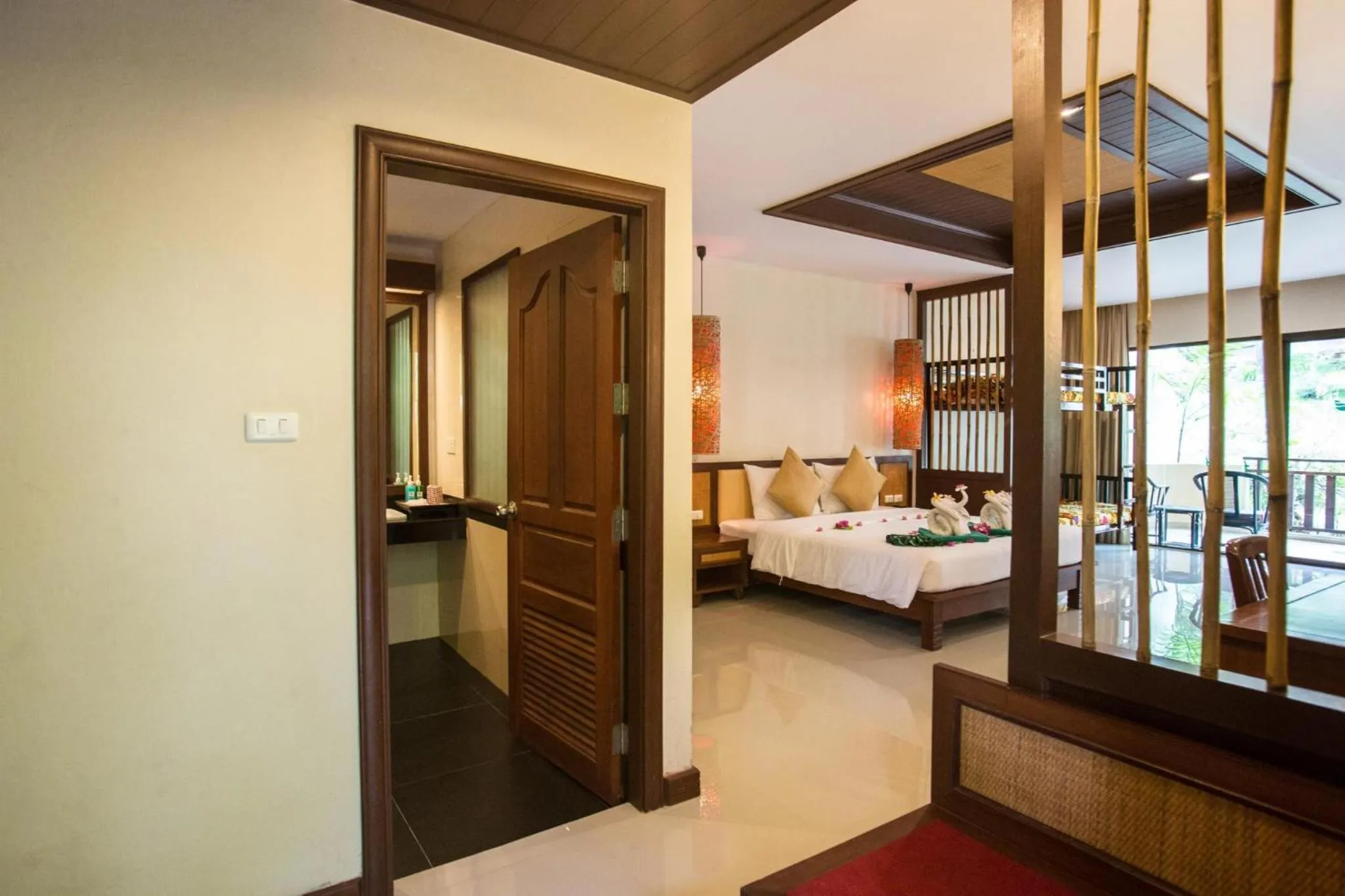 Photo of the whole room, Bed in Hotel and Beach Bungalow at Lanta Resort