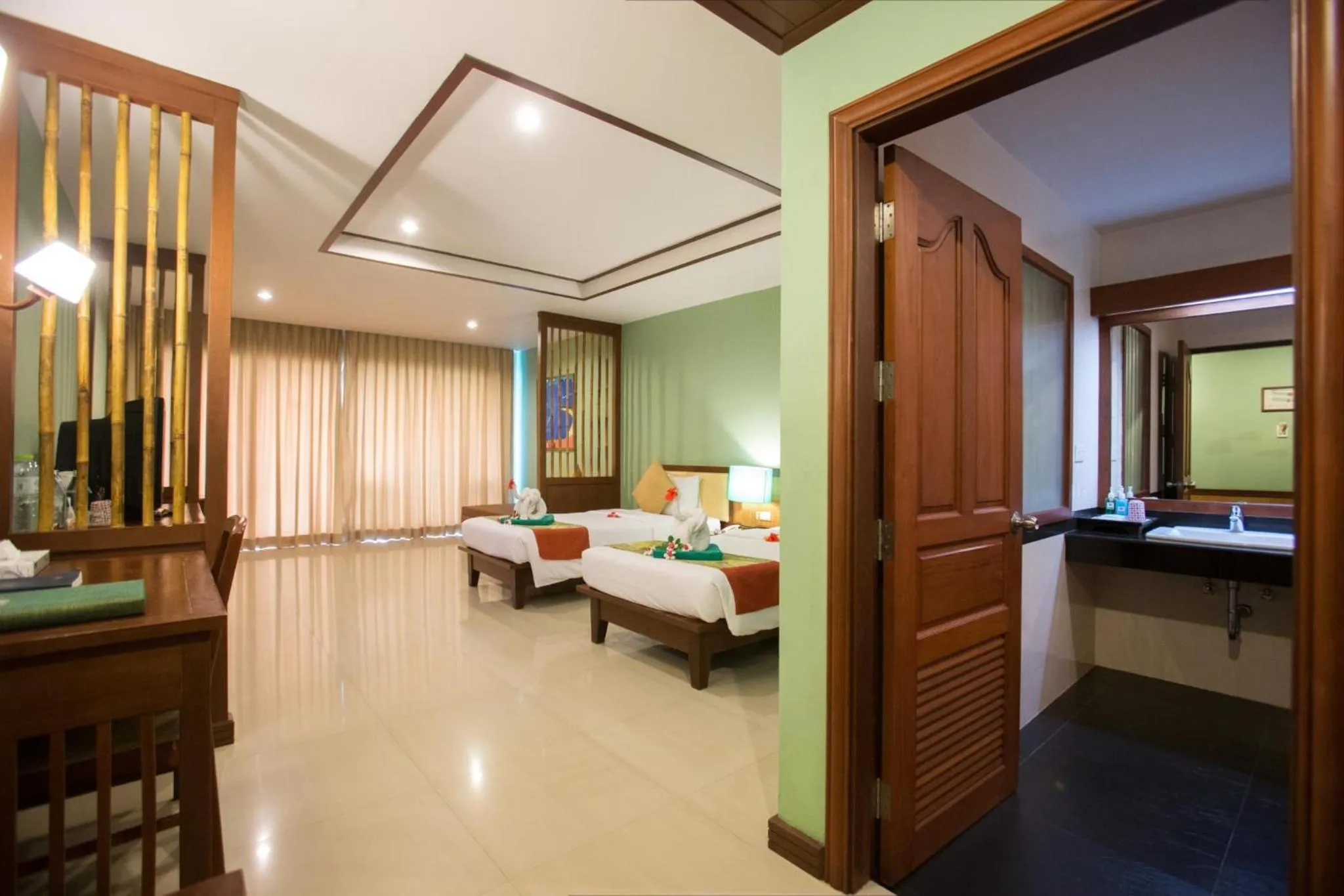 Bed in Hotel and Beach Bungalow at Lanta Resort