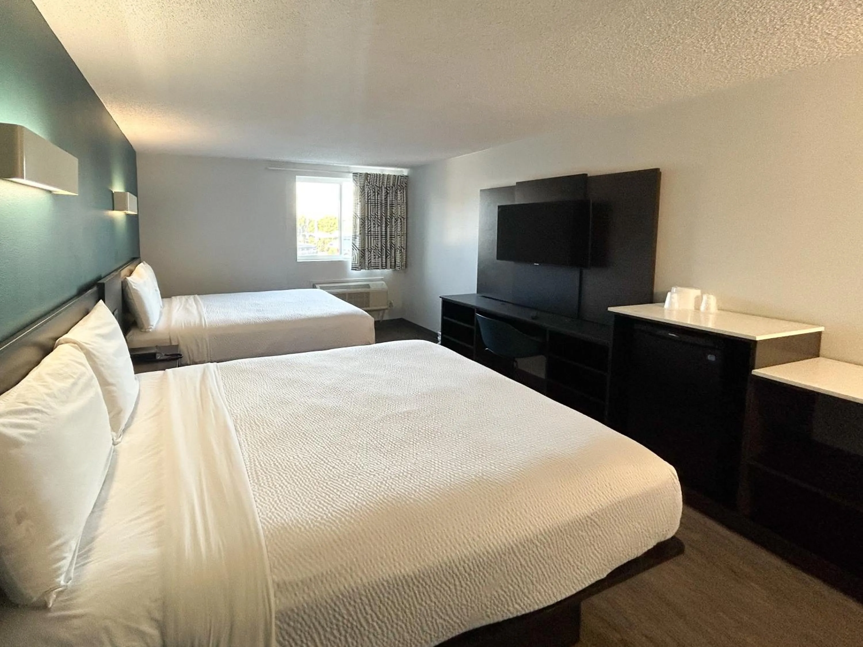 Bedroom, Bed in Studio 6 Suites Carson, CA