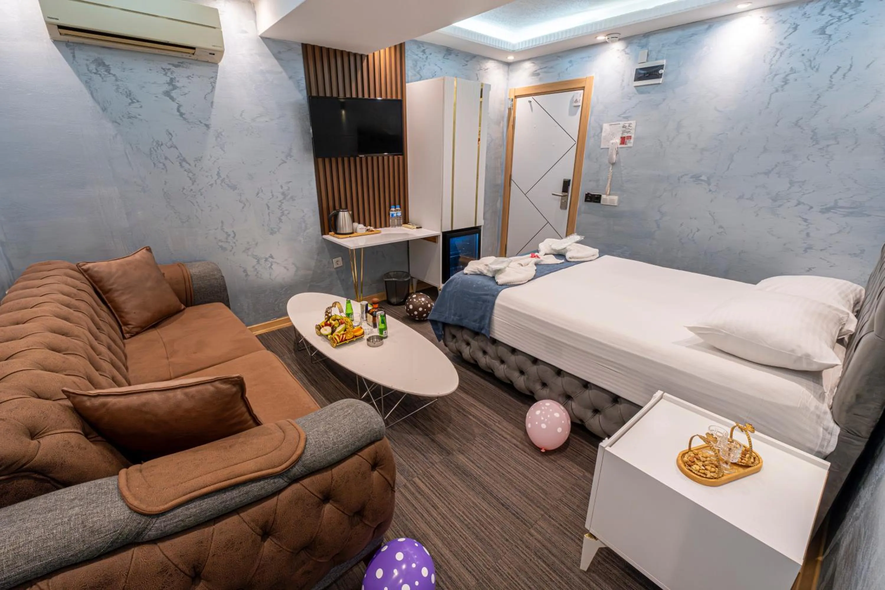 Bed in Stay Suite Hotel