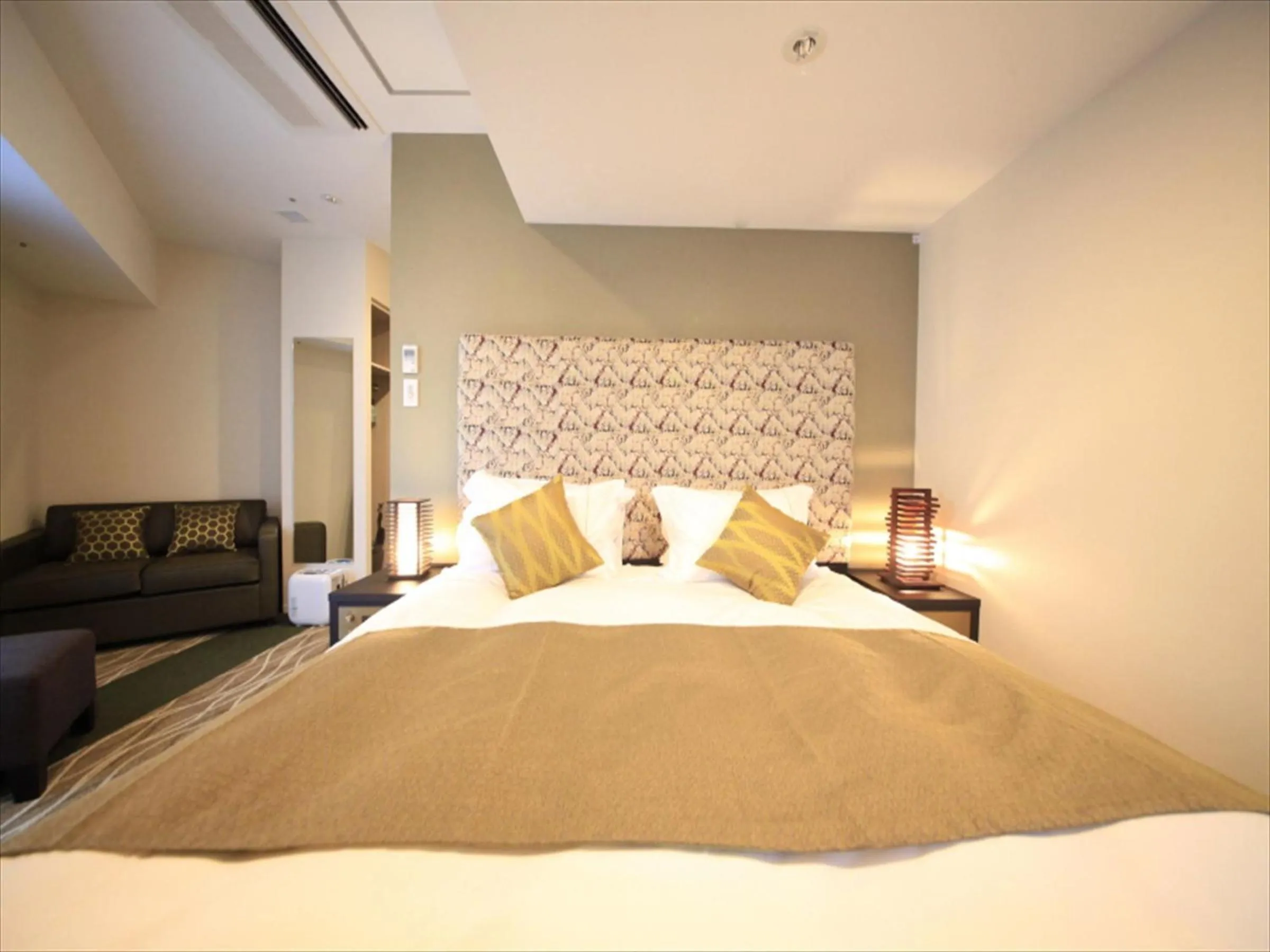 Bed in Centurion Hotel Ikebukuro Station