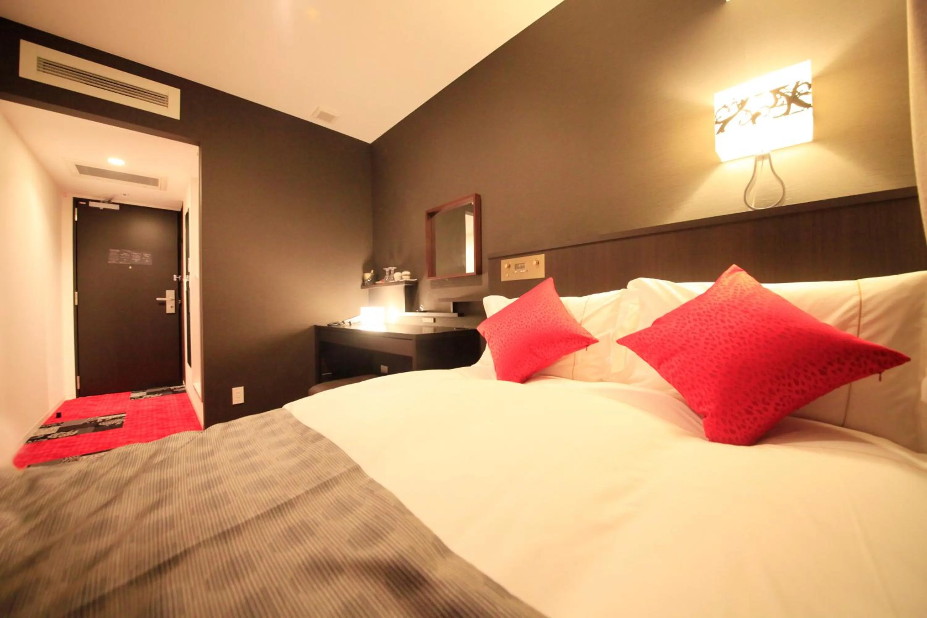 Photo of the whole room, Bed in Centurion Hotel Ikebukuro Station