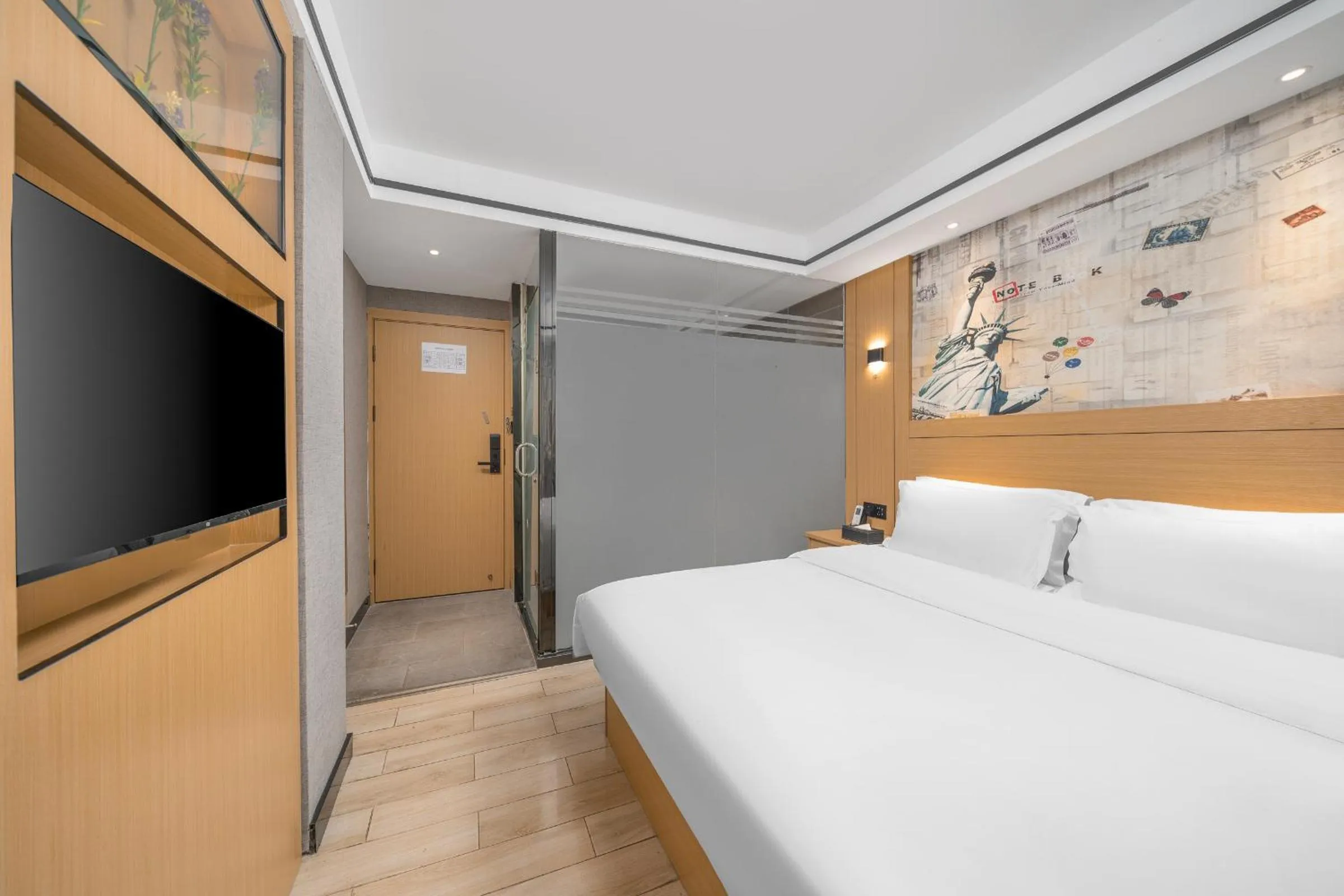 Bed in Yi Nuo Hotel Guangzhou