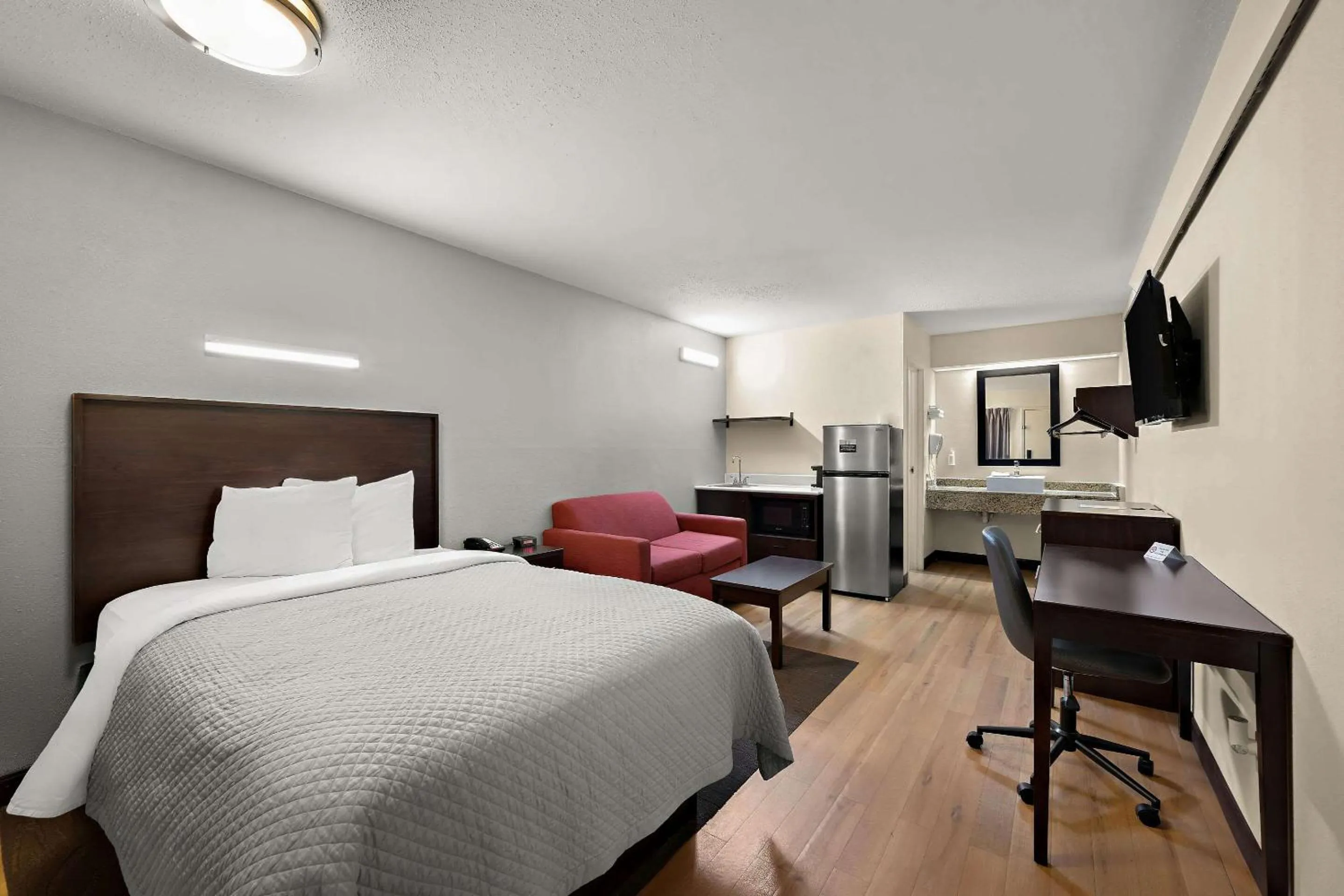 Bedroom, Bed in Suburban Studios Peoria